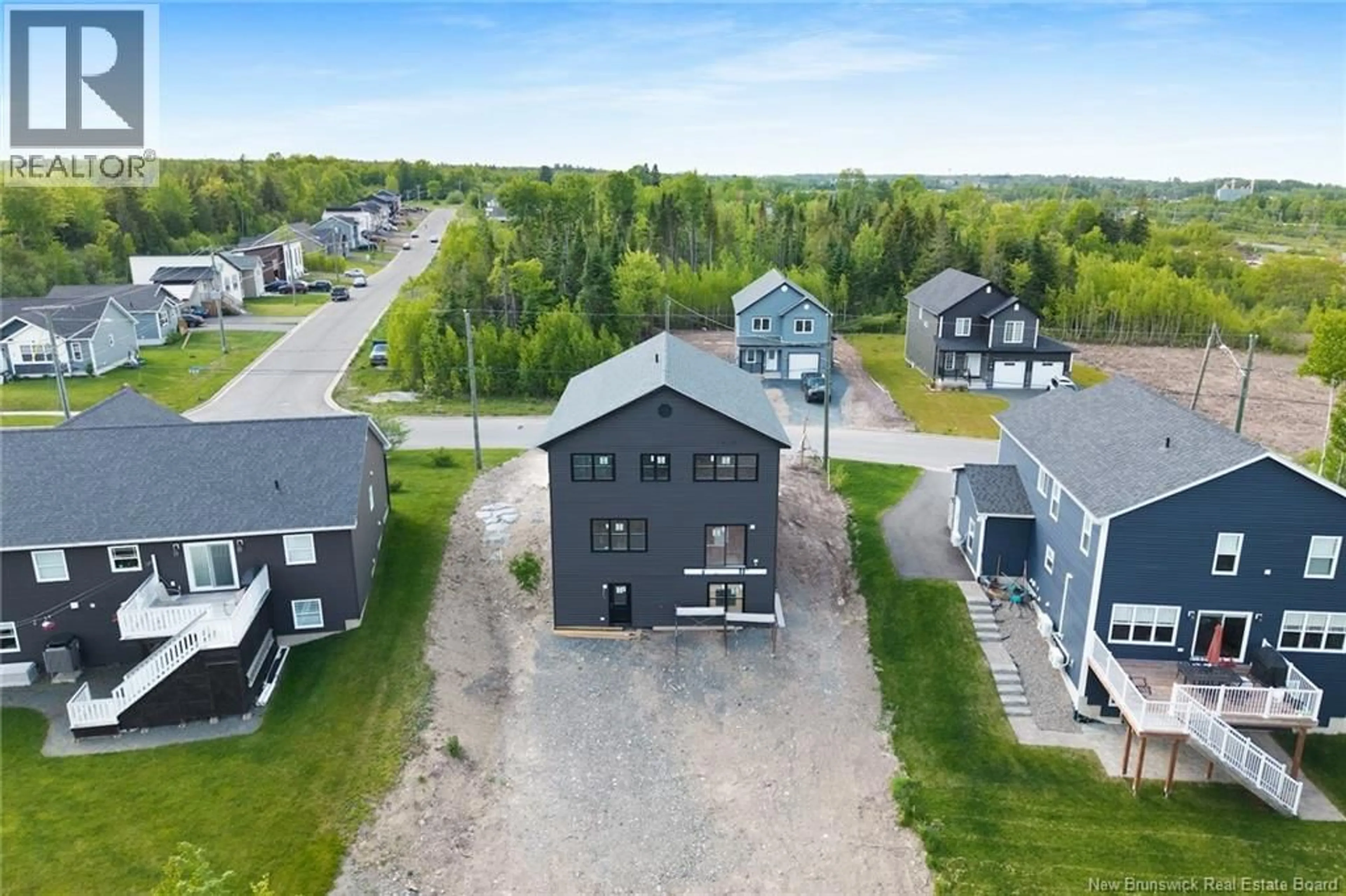 A pic from outside/outdoor area/front of a property/back of a property/a pic from drone, unknown for 39 WINTERBERRY DRIVE, Fredericton New Brunswick E3C0M3