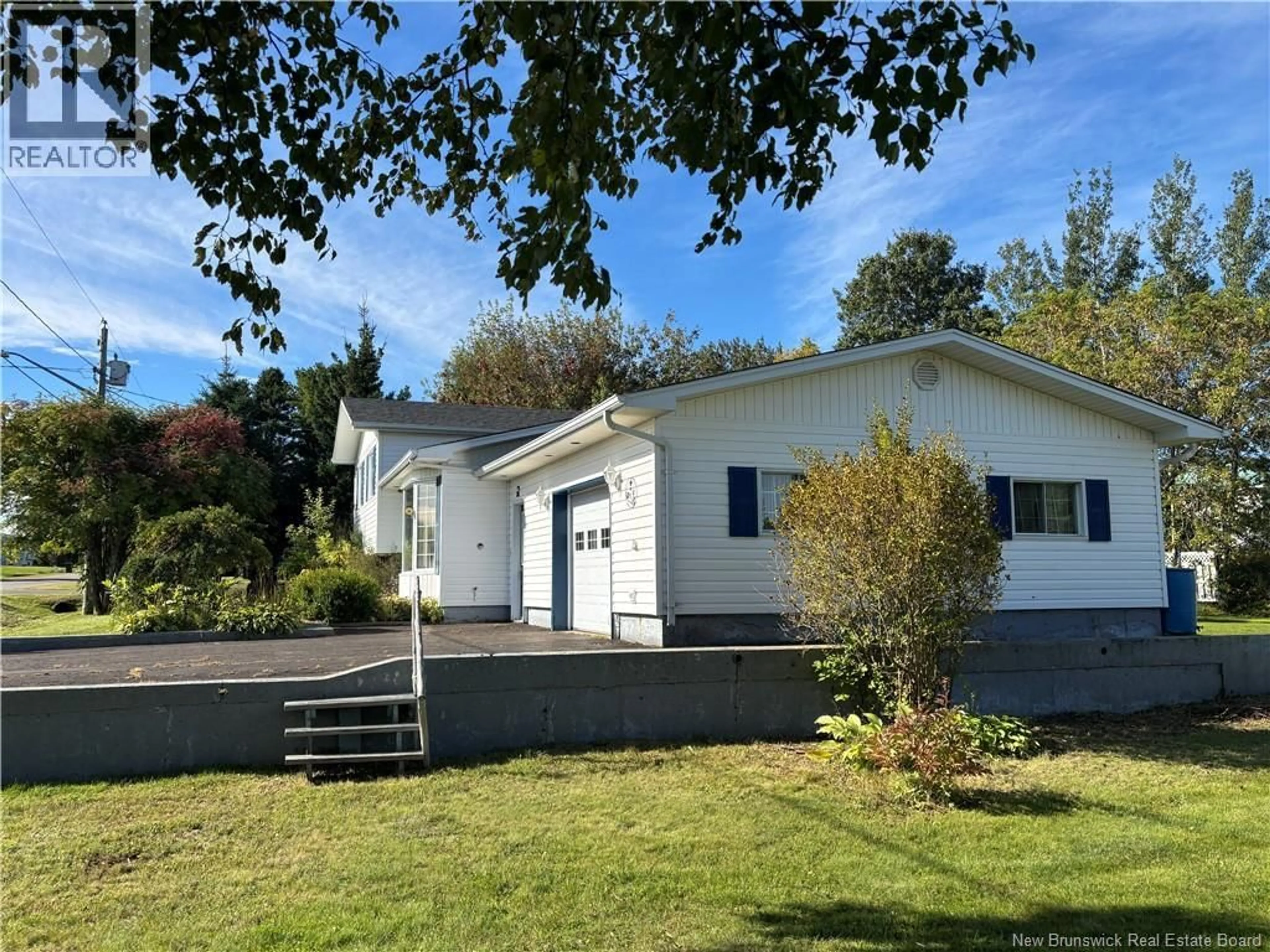 A pic from outside/outdoor area/front of a property/back of a property/a pic from drone, street for 28 CARR ST, Belledune New Brunswick E8G1Y6