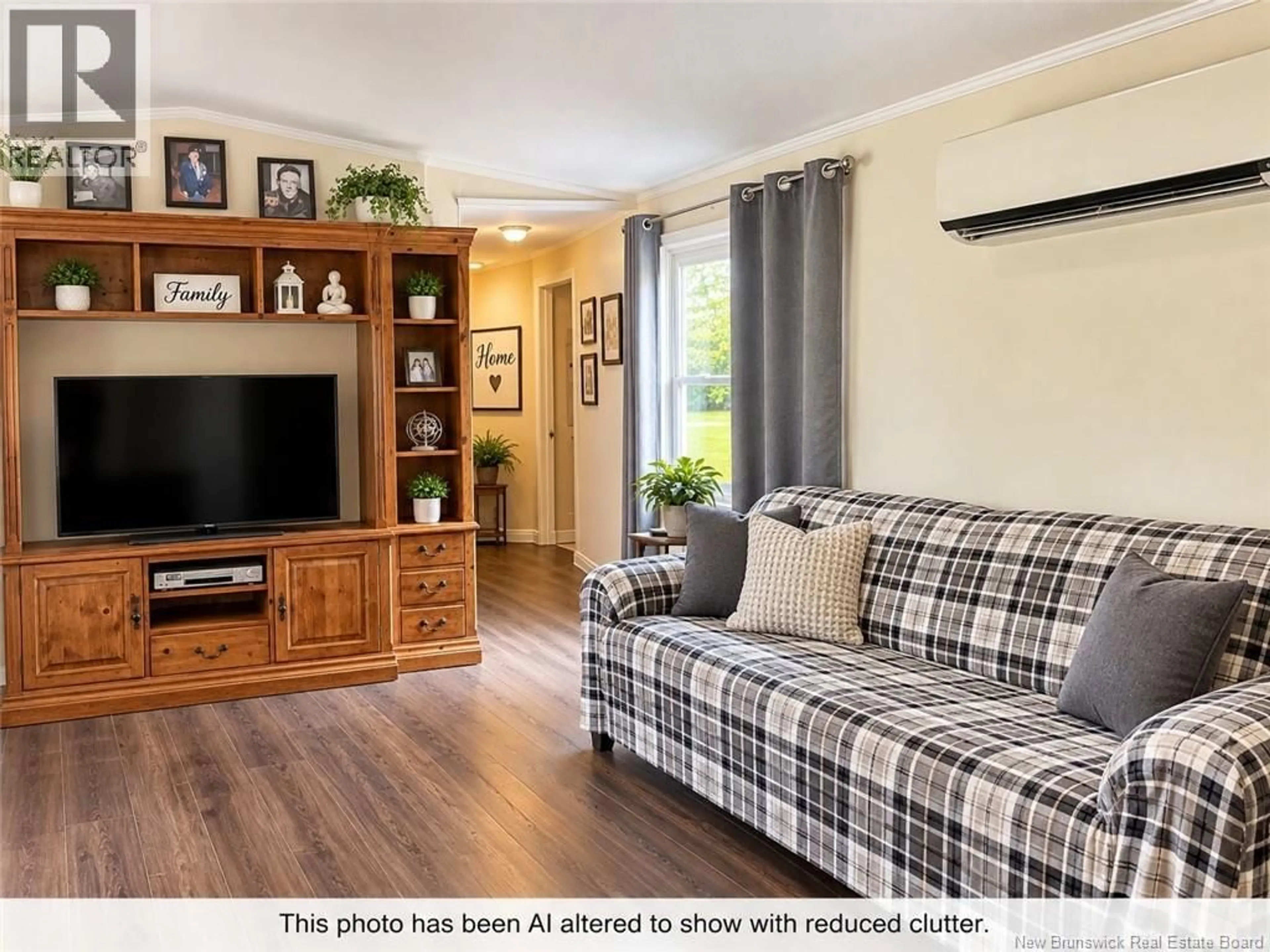 Living room with furniture, wood/laminate floor for 12 AUBE LANE, Belledune New Brunswick E8G1X5