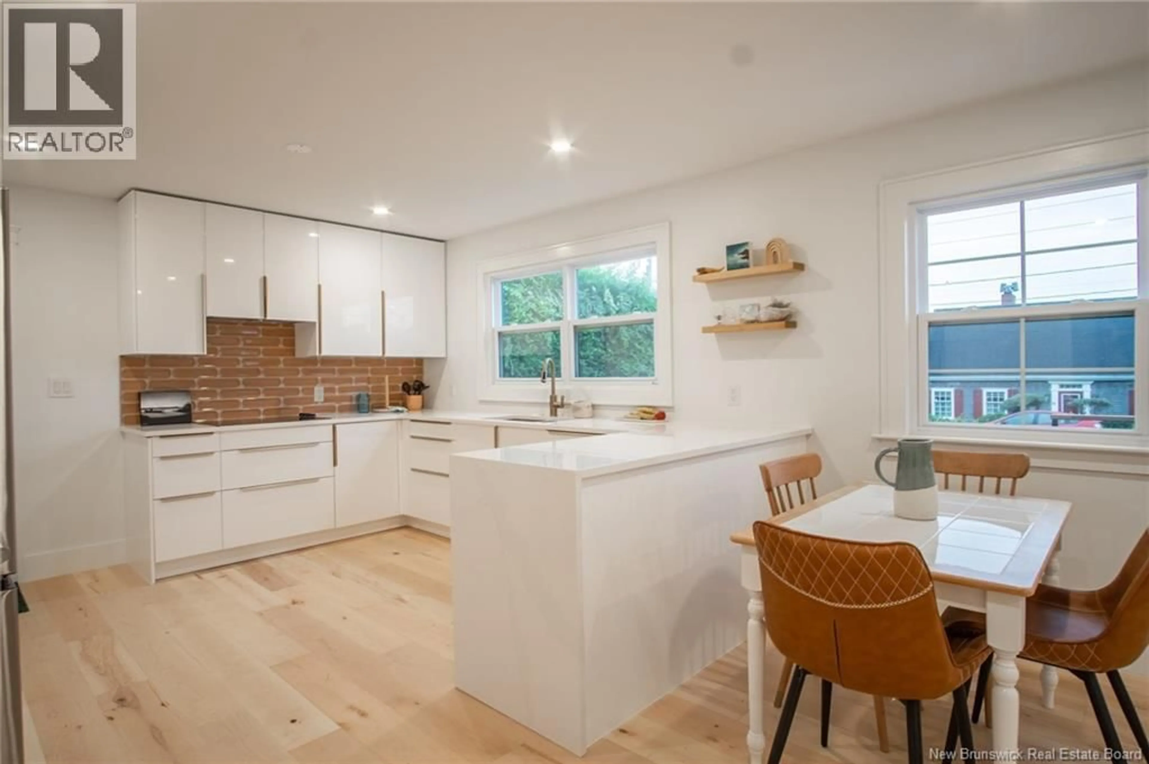 Open concept kitchen, wood/laminate floor for 66 WATER STREET, Saint Andrews New Brunswick E5B1A7