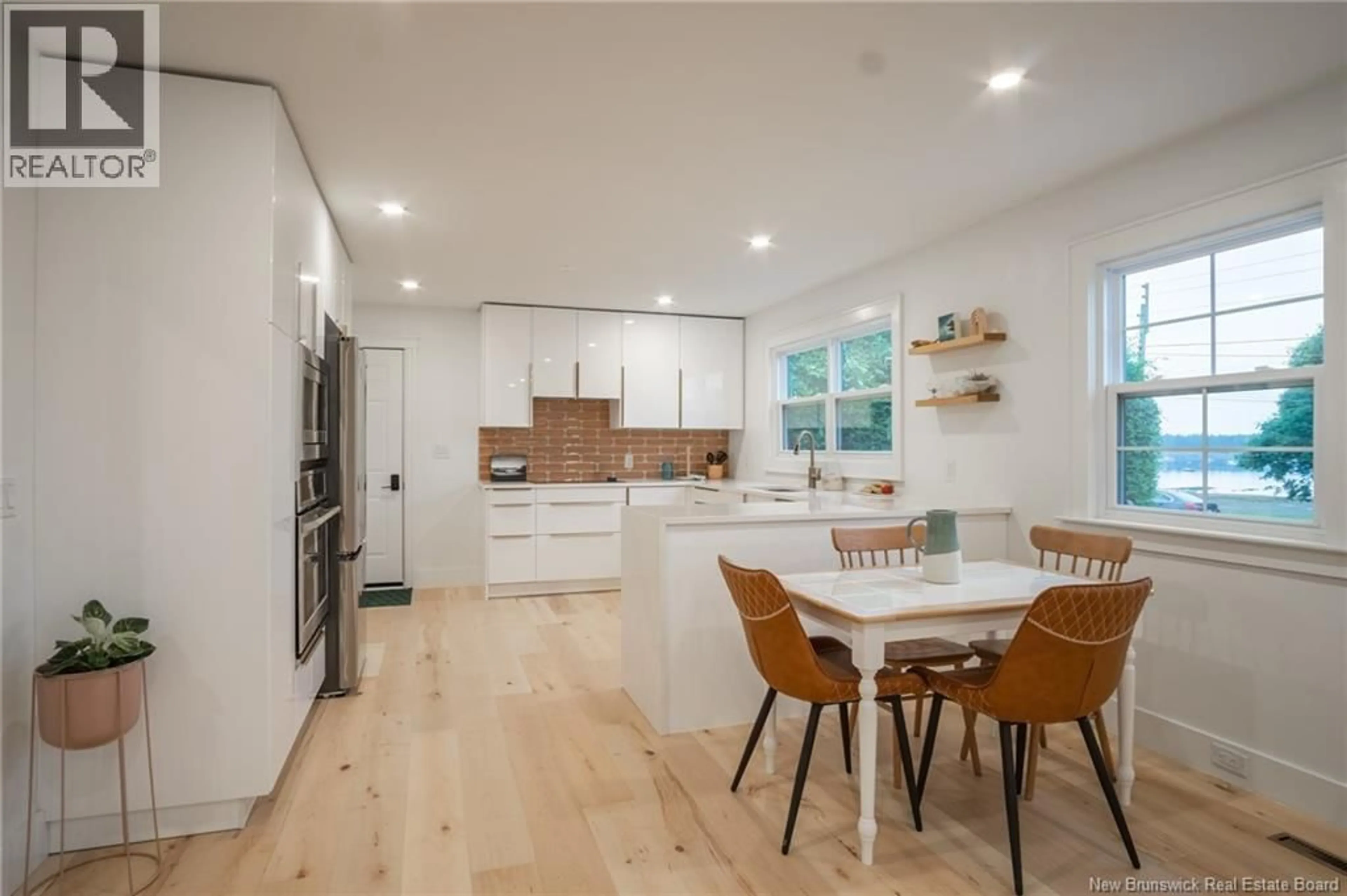 Open concept kitchen, wood/laminate floor for 66 WATER STREET, Saint Andrews New Brunswick E5B1A7