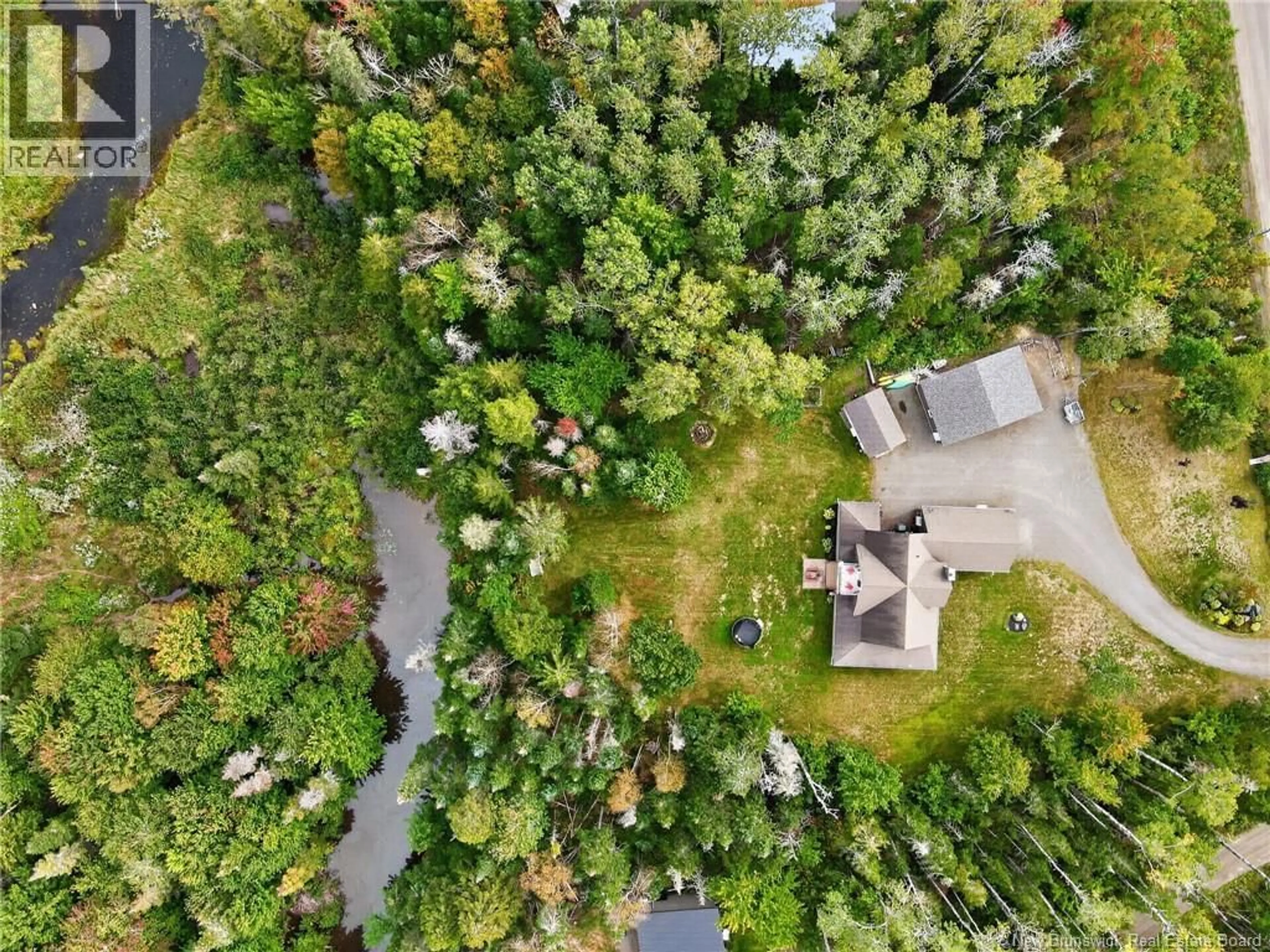 A pic from outside/outdoor area/front of a property/back of a property/a pic from drone, forest/trees view for 10 WATERWAY ROAD, McQuade New Brunswick E1G0S8