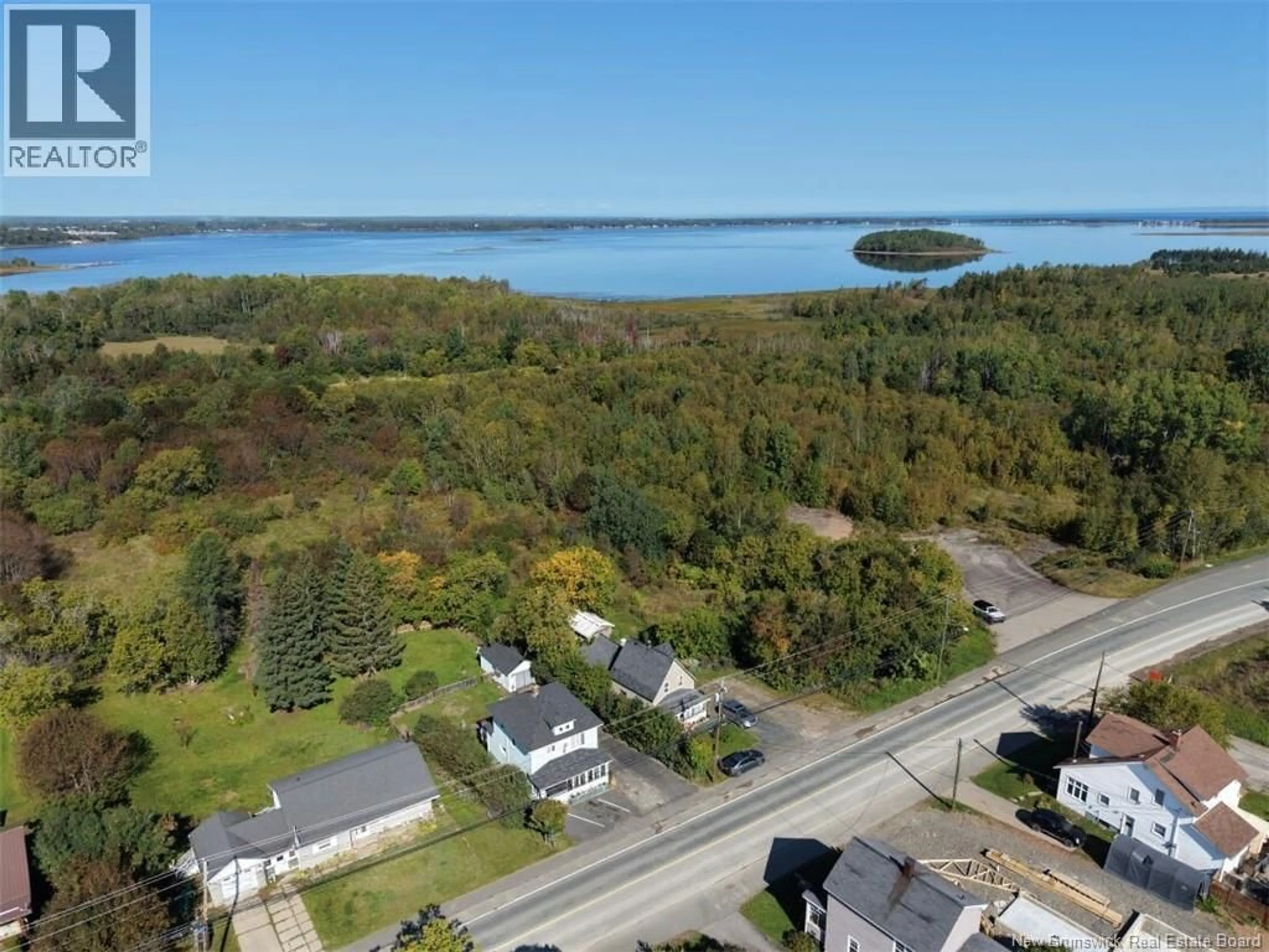 A pic from outside/outdoor area/front of a property/back of a property/a pic from drone, water/lake/river/ocean view for 745 BRIDGE, Bathurst New Brunswick E2A1W9