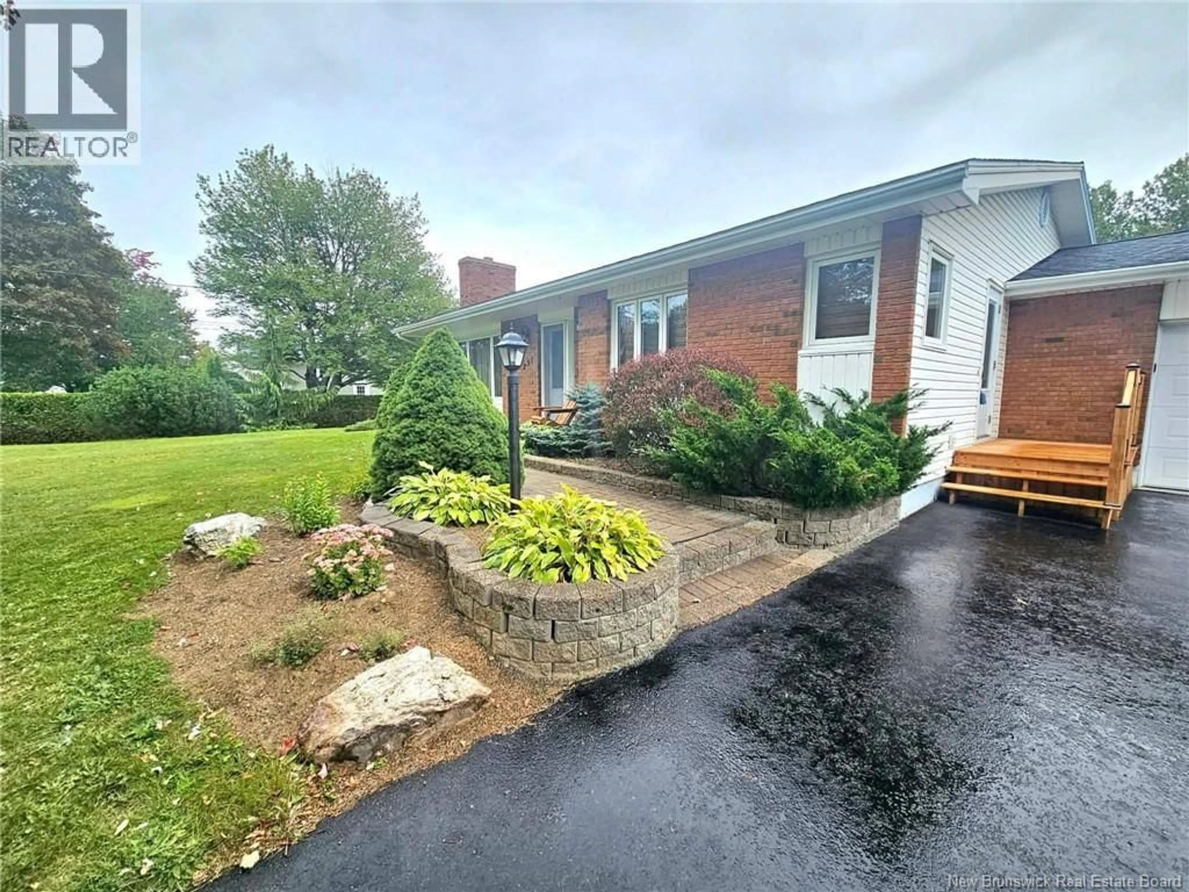 A pic from outside/outdoor area/front of a property/back of a property/a pic from drone, street for 251 LANDRY, Beresford New Brunswick E8K1G9