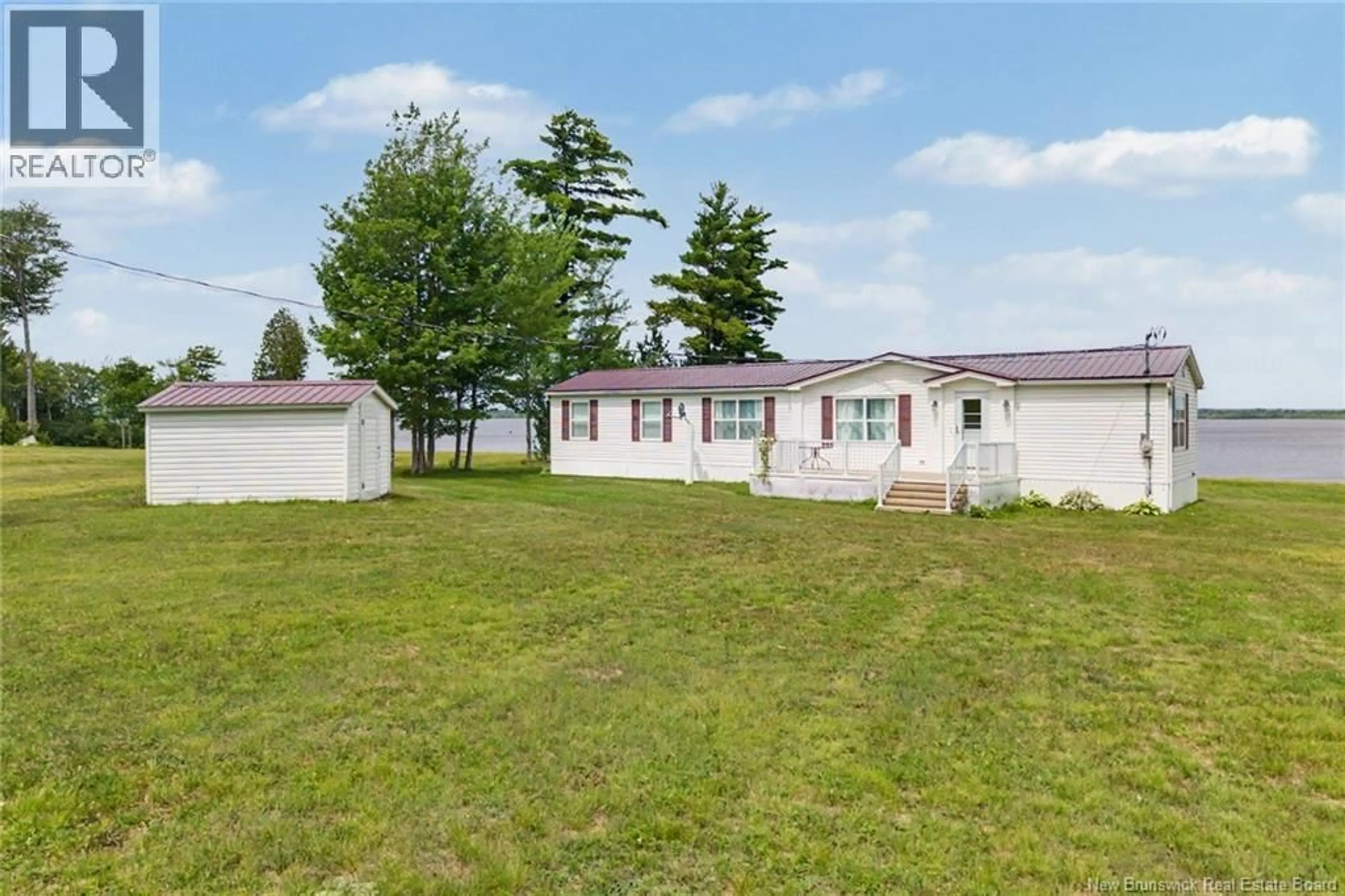 A pic from outside/outdoor area/front of a property/back of a property/a pic from drone, unknown for 388 COX POINT ROAD, Cumberland Bay New Brunswick E4A2X7