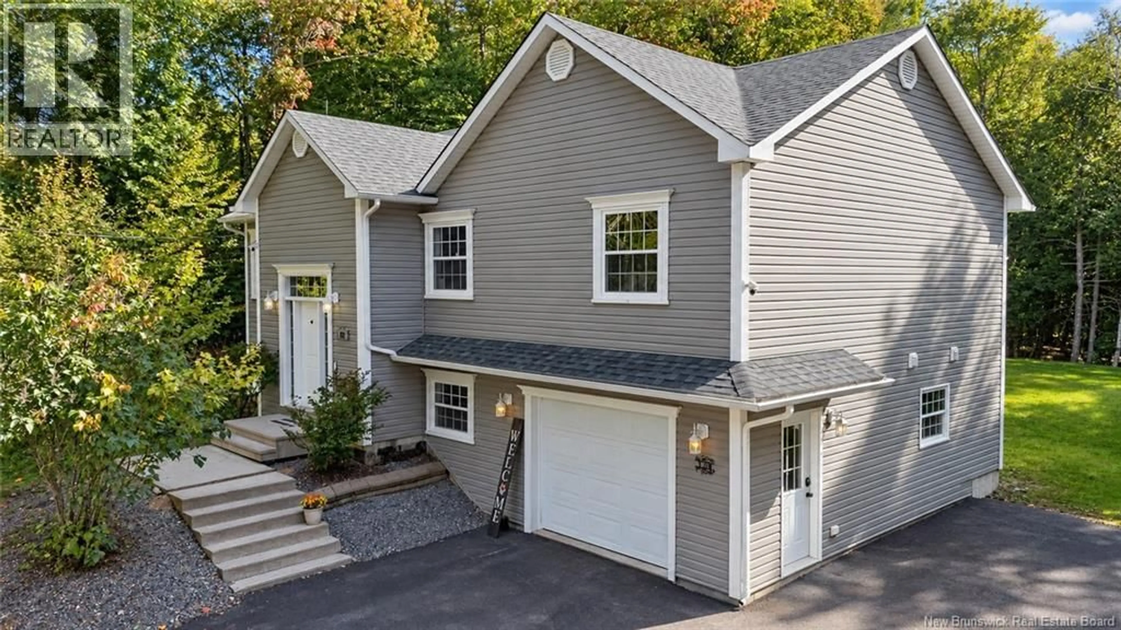 Home with vinyl exterior material, street for 128 COUNTRY WOOD LANE, Richibucto Road New Brunswick E3A0Y6