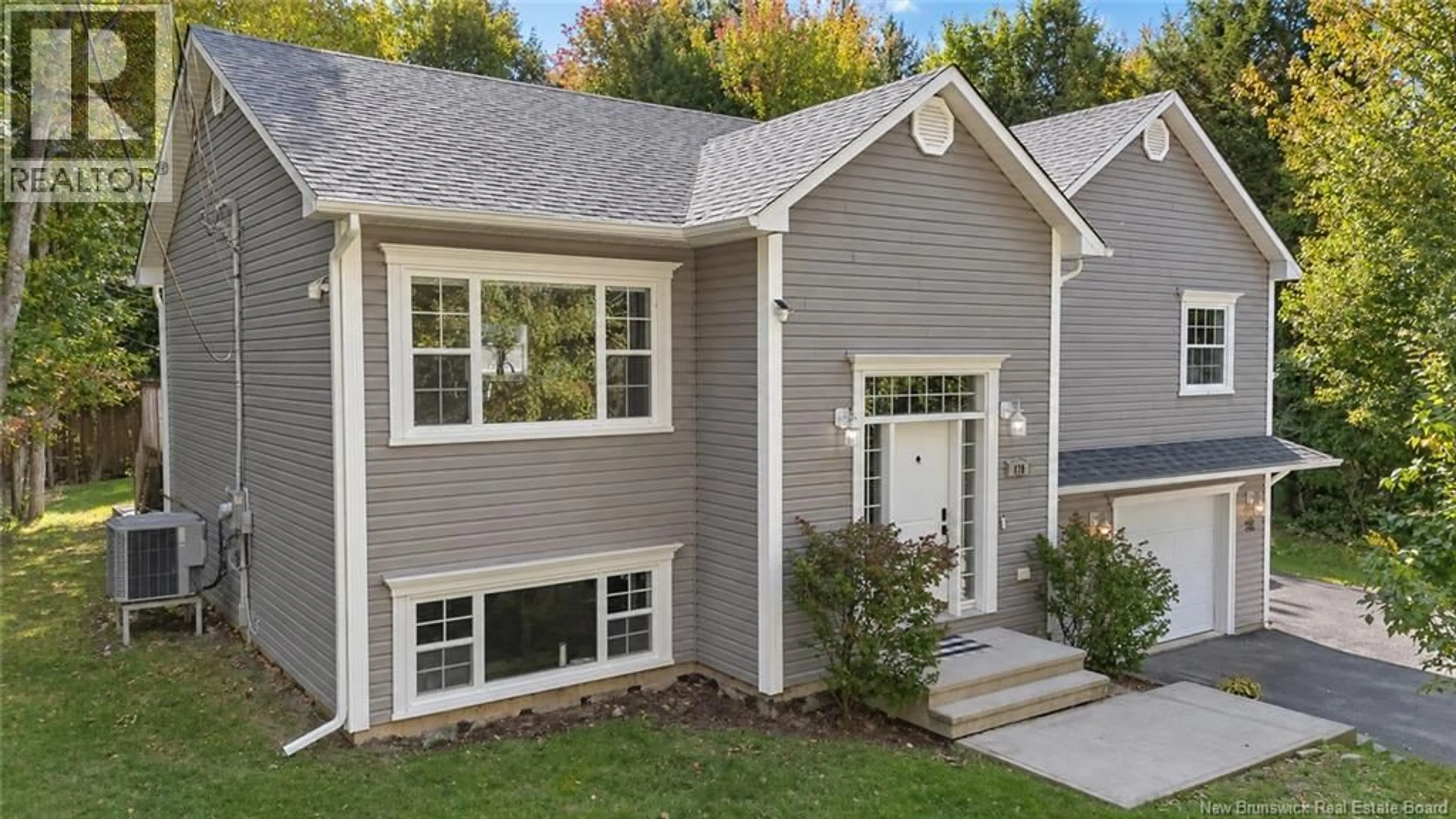 Home with vinyl exterior material, street for 128 COUNTRY WOOD LANE, Richibucto Road New Brunswick E3A0Y6