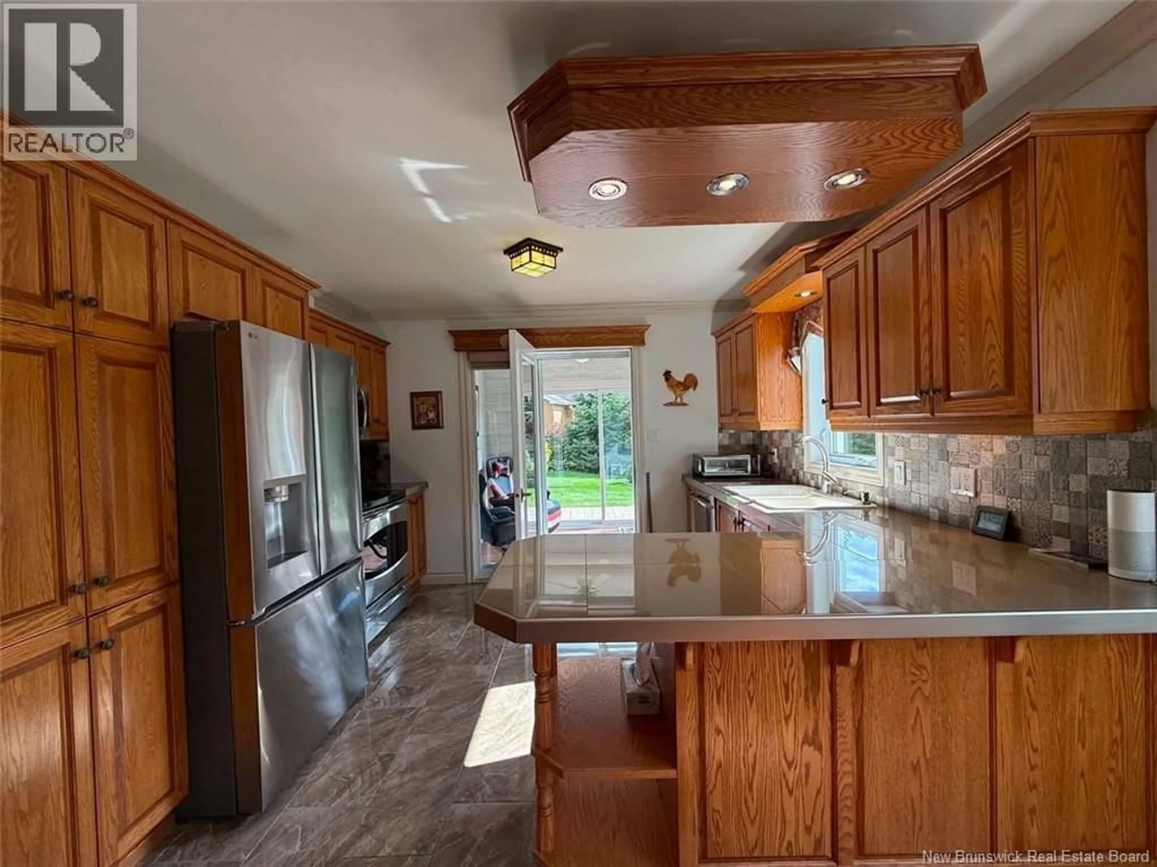 Open concept kitchen, ceramic/tile floor for 45 PERRON STREET, Edmundston New Brunswick E3V0A6