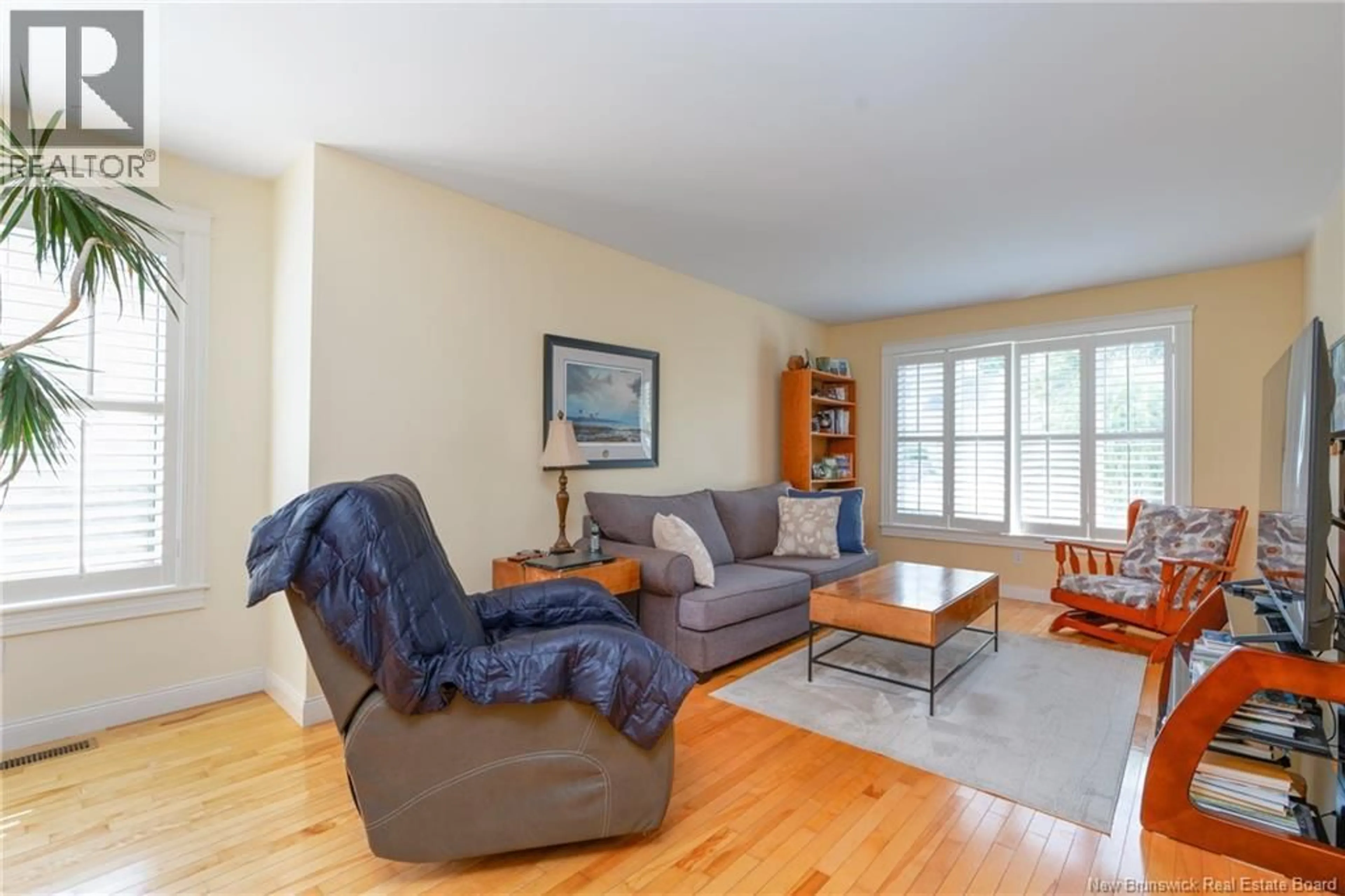 Living room with furniture, wood/laminate floor for 43 RIDGEWELL PLACE, Fredericton New Brunswick E3B6J9