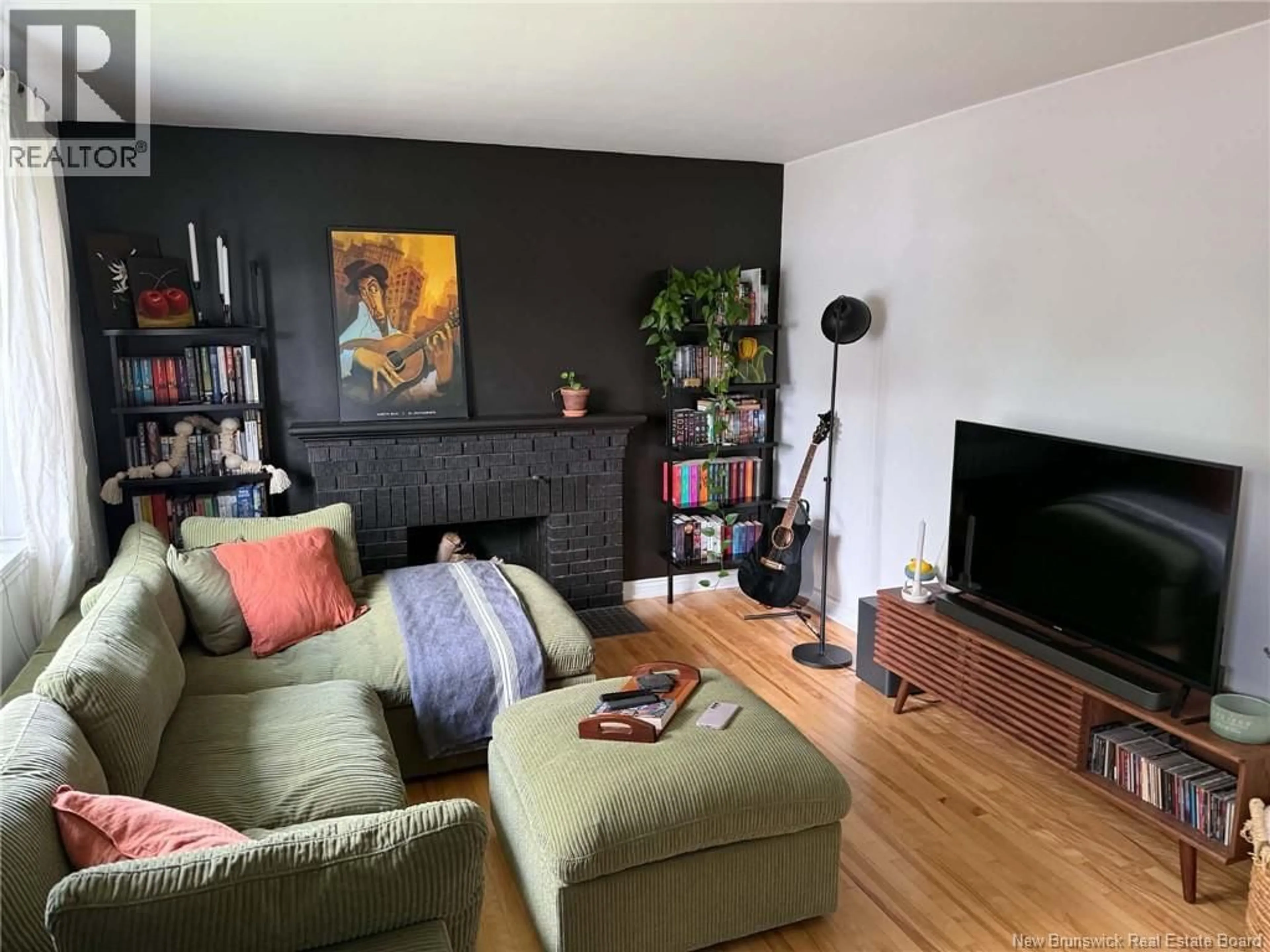 Living room with furniture, wood/laminate floor for 244 LESLIE STREET, Moncton New Brunswick E1C6M9