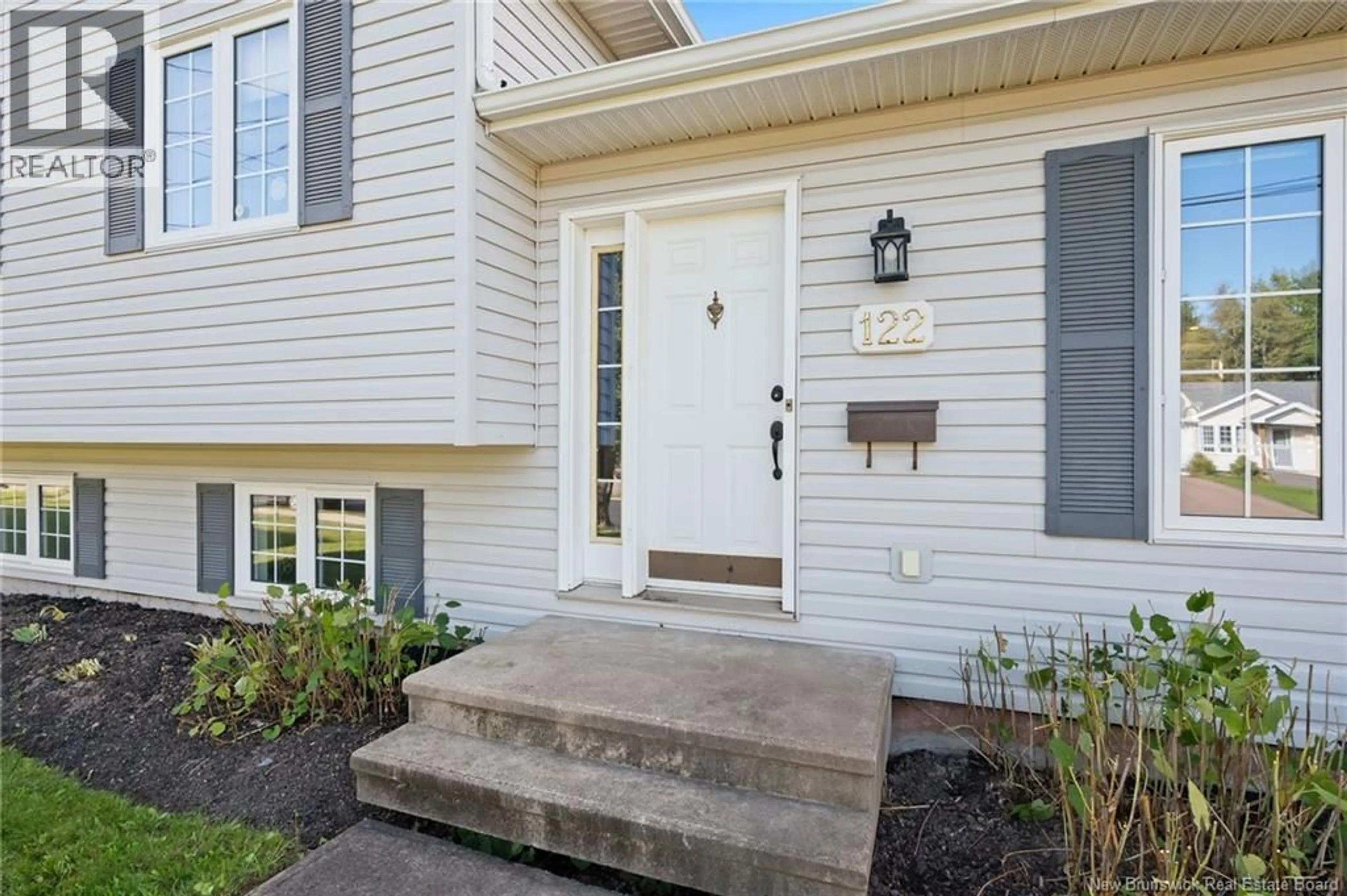 Home with vinyl exterior material, street for 122 DOLBEAU STREET, Dieppe New Brunswick E1A6V6