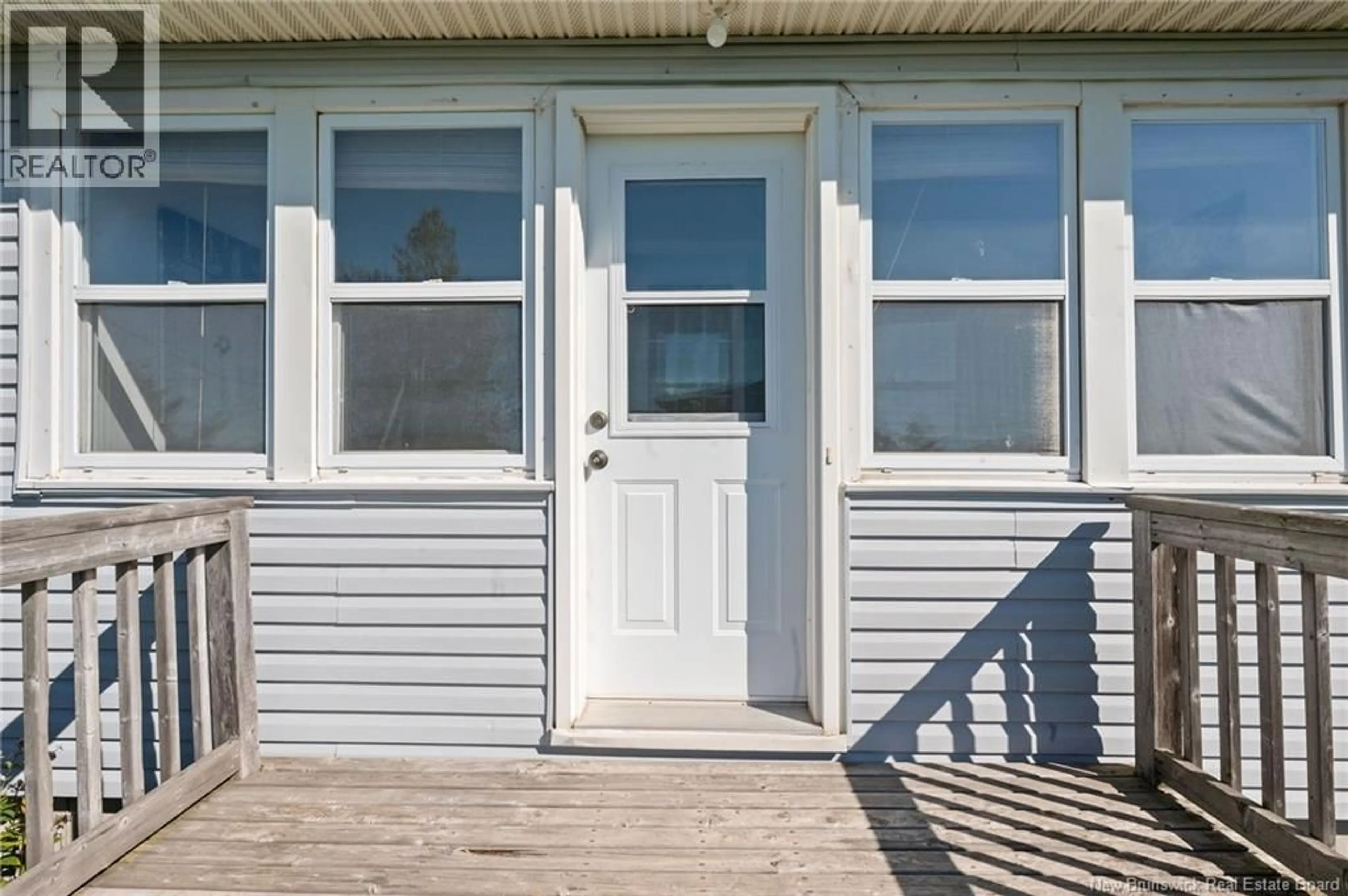Home with vinyl exterior material, street for 92 SURETTE ROAD, Grande-Digue New Brunswick E4R5V5