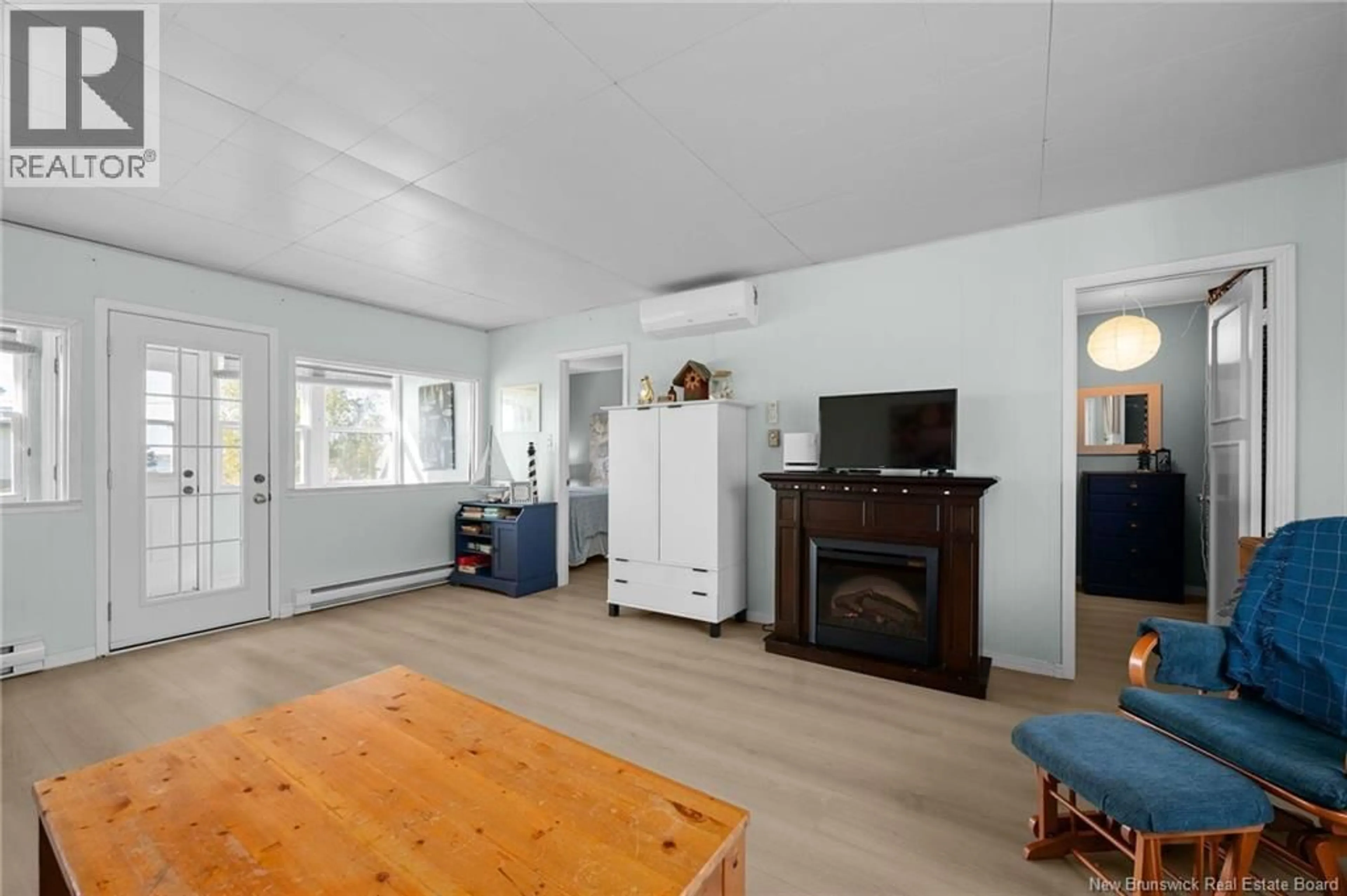 Living room with furniture, wood/laminate floor for 92 SURETTE ROAD, Grande-Digue New Brunswick E4R5V5