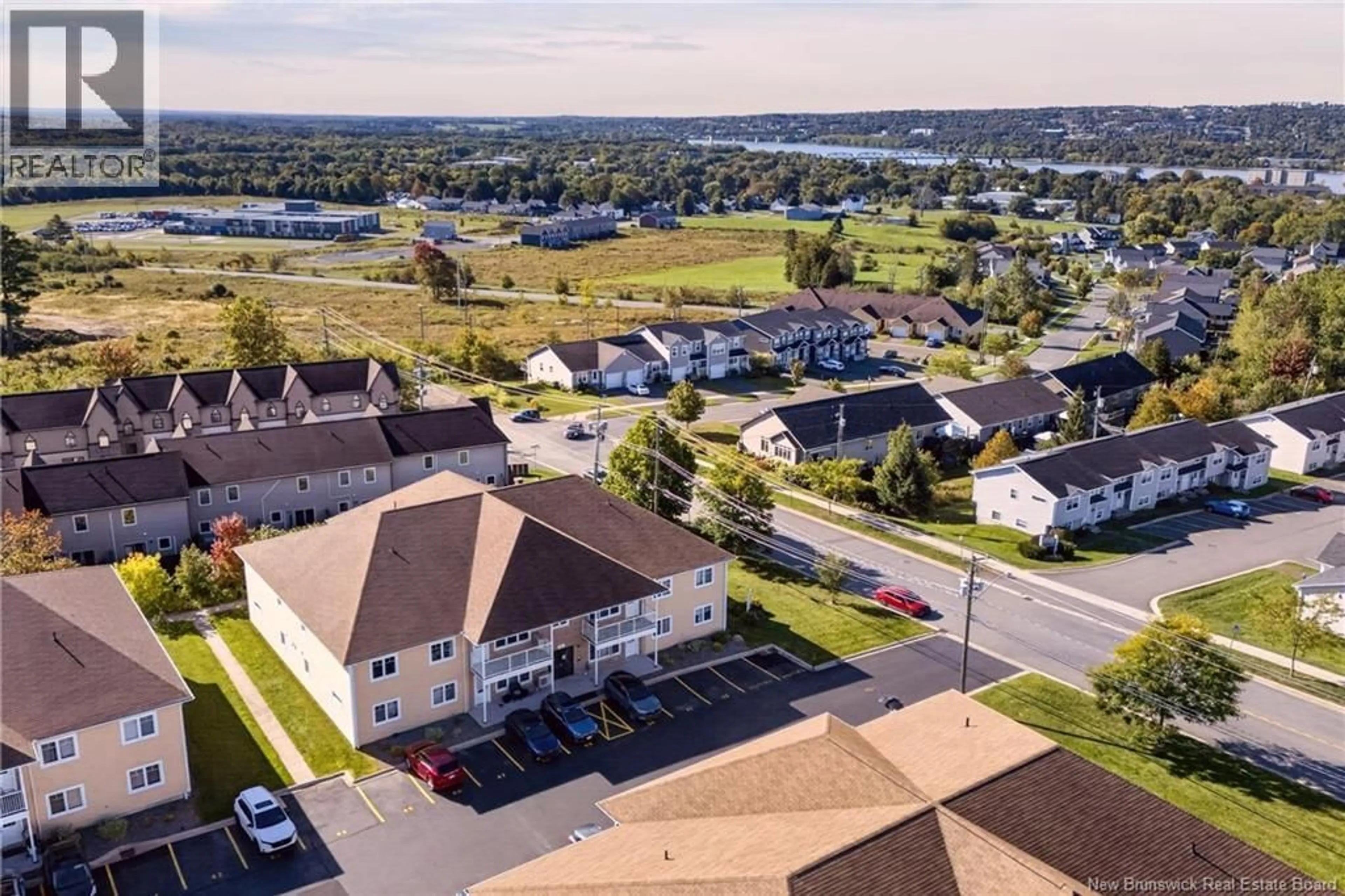 A pic from outside/outdoor area/front of a property/back of a property/a pic from drone, water/lake/river/ocean view for 214 - 39 SUNNY BRAE DRIVE, Fredericton New Brunswick E3A5M2