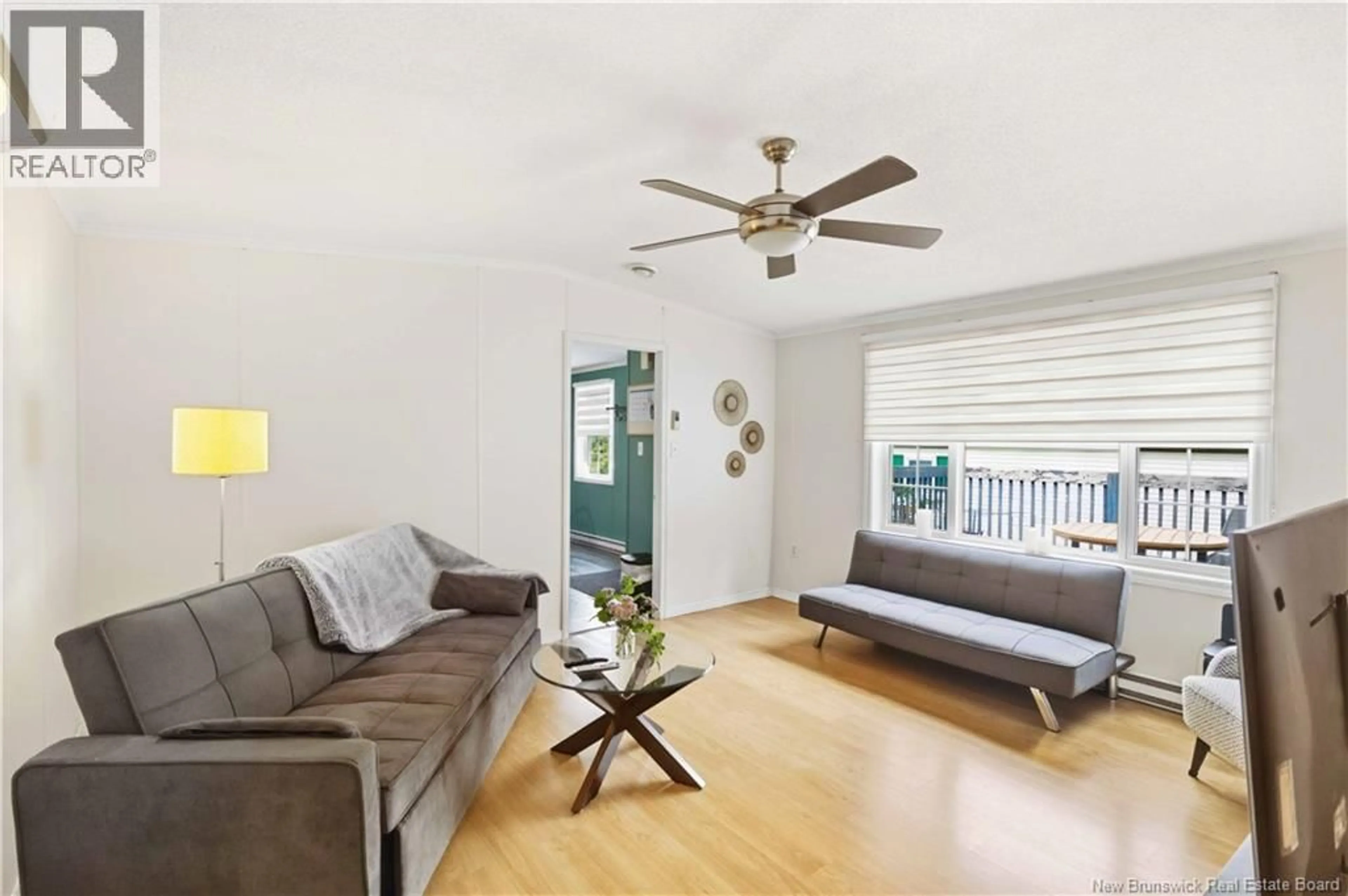 Living room with furniture, wood/laminate floor for 442 OSMOND LANE, Fredericton New Brunswick E3B7L6
