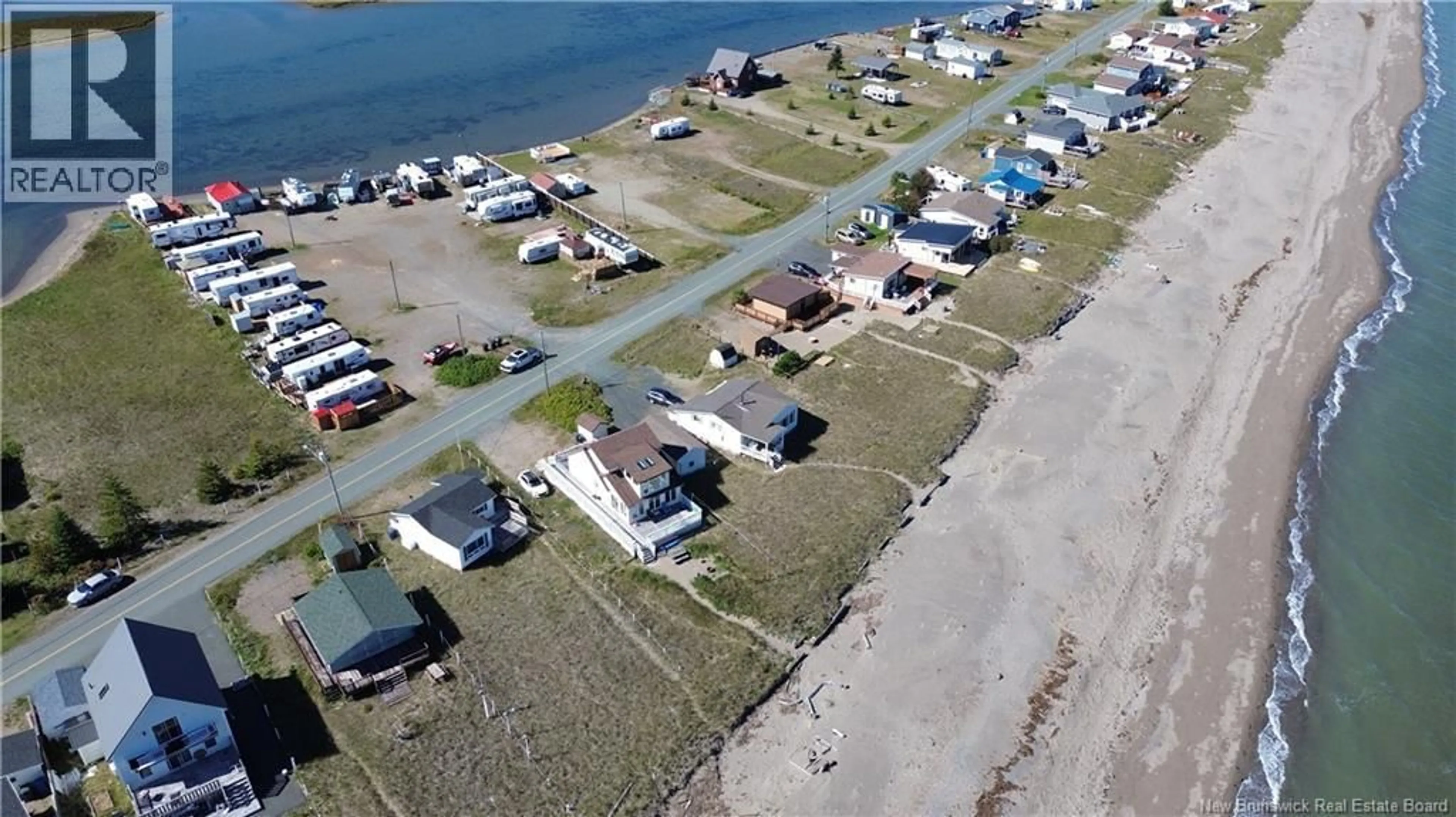 A pic from outside/outdoor area/front of a property/back of a property/a pic from drone, water/lake/river/ocean view for 1011 JOHN CORMIER, Beresford New Brunswick E8K1W3
