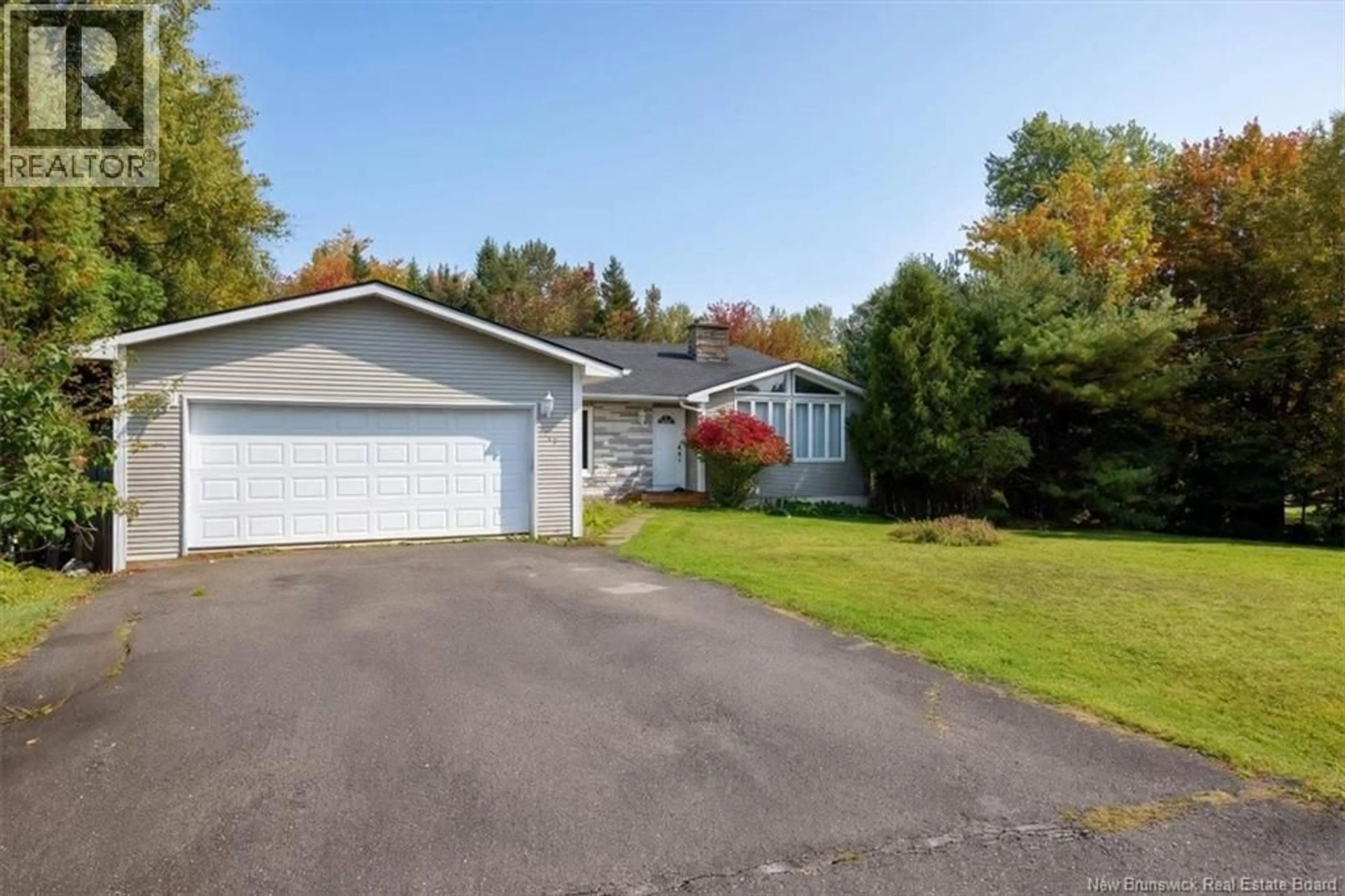 A pic from outside/outdoor area/front of a property/back of a property/a pic from drone, street for 4 HUGHES CRESCENT, Quispamsis New Brunswick E2E2S9