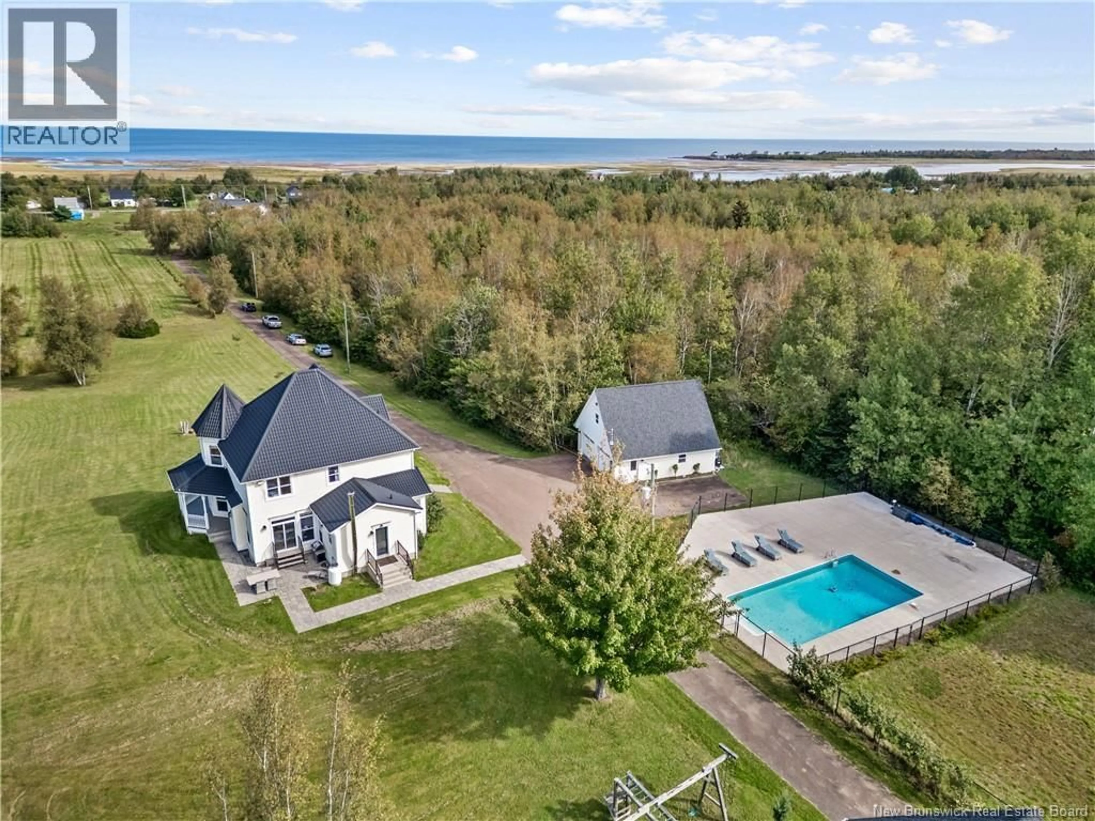 A pic from outside/outdoor area/front of a property/back of a property/a pic from drone, water/lake/river/ocean view for 1095 ROUTE 133, Grand-Barachois New Brunswick E4P8G3