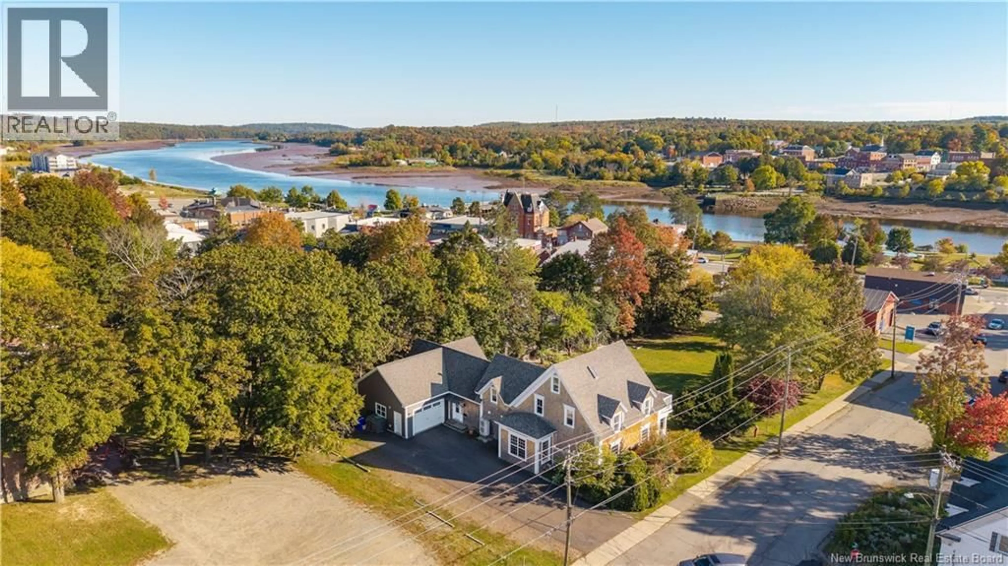 A pic from outside/outdoor area/front of a property/back of a property/a pic from drone, water/lake/river/ocean view for 15 MARKS STREET, St. Stephen New Brunswick E3L2A9