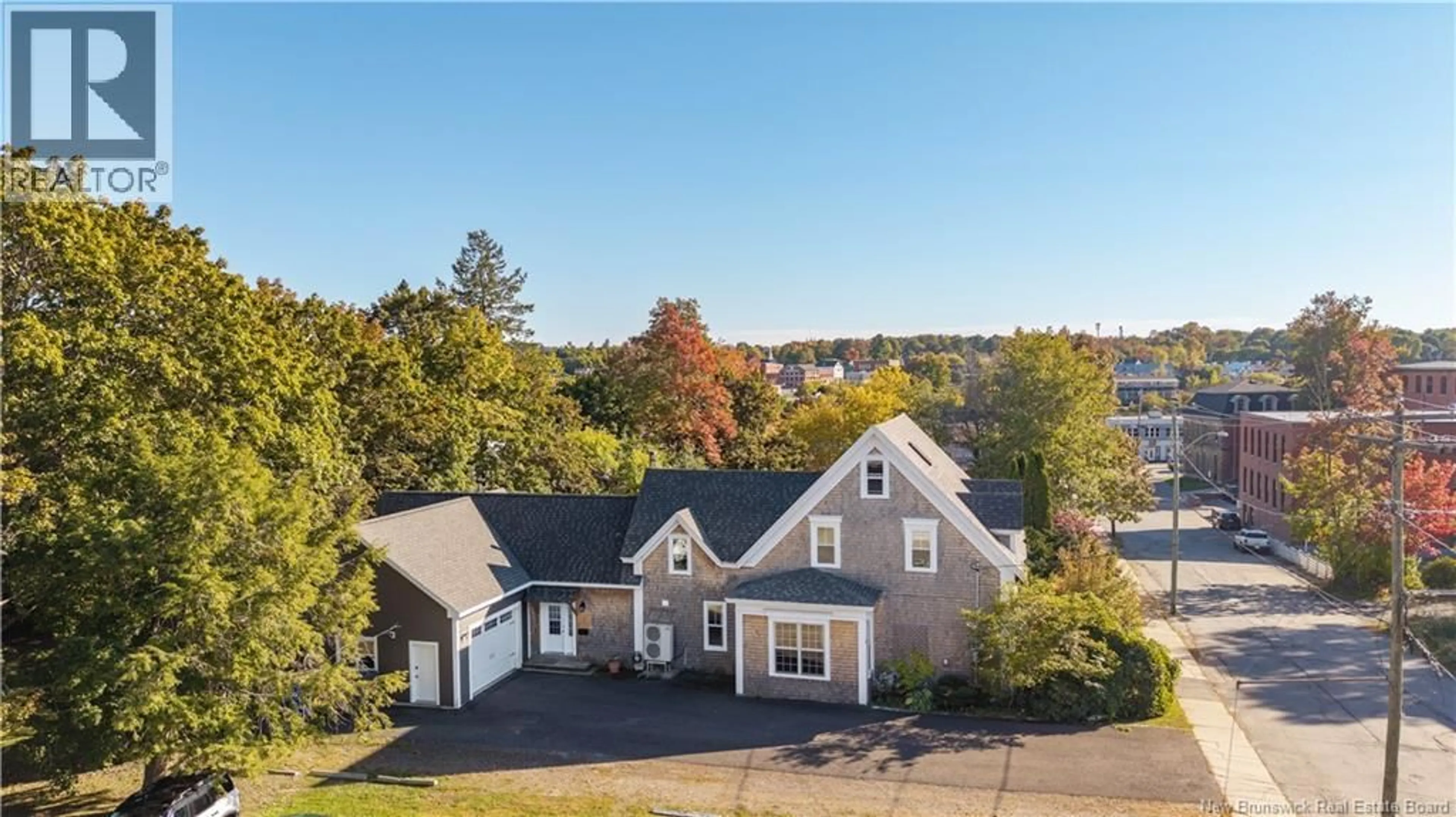 A pic from outside/outdoor area/front of a property/back of a property/a pic from drone, water/lake/river/ocean view for 15 MARKS STREET, St. Stephen New Brunswick E3L2A9