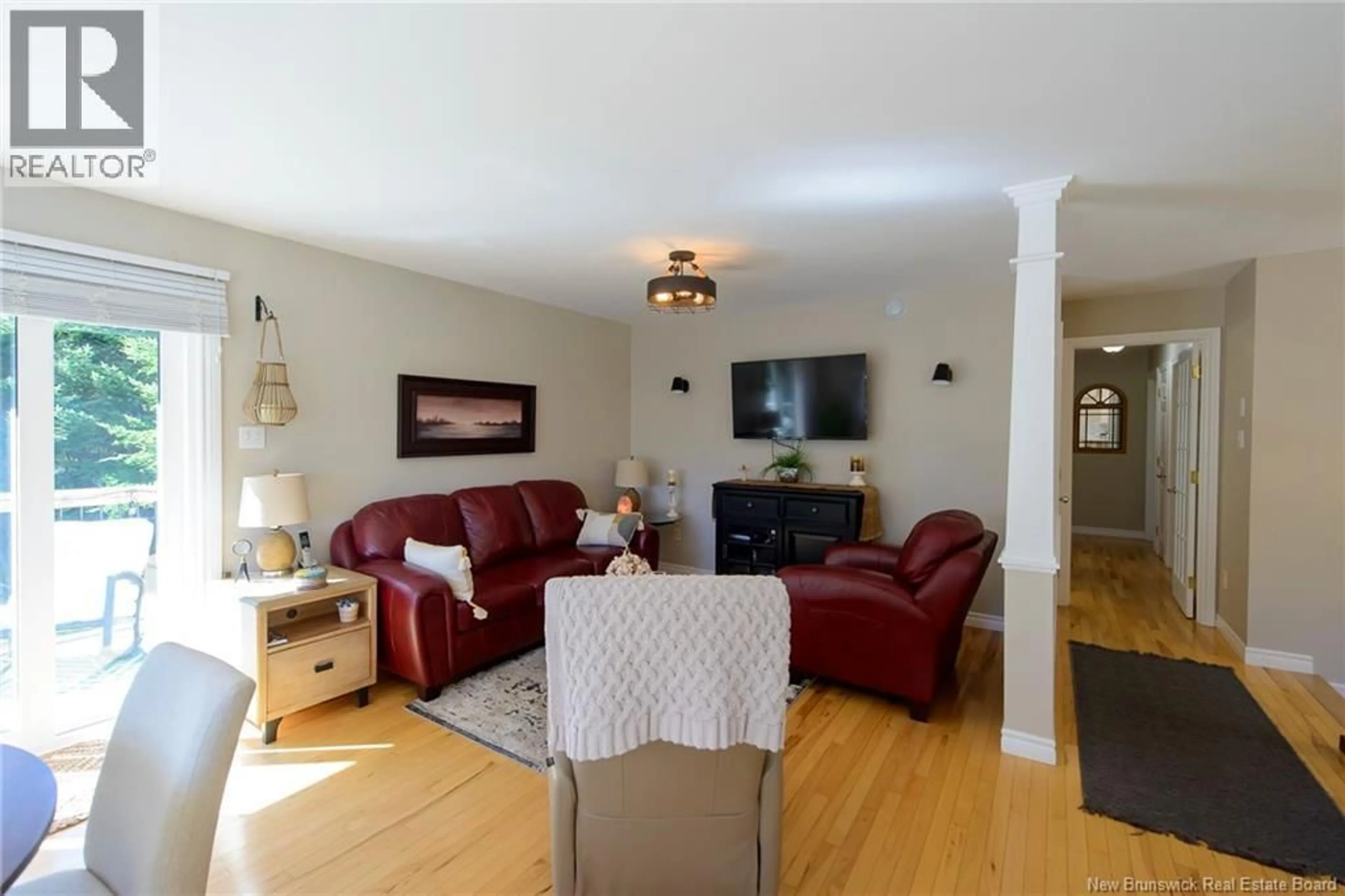 Living room with furniture, wood/laminate floor for 22 SUNDANCE DRIVE, Quispamsis New Brunswick E2E2S3