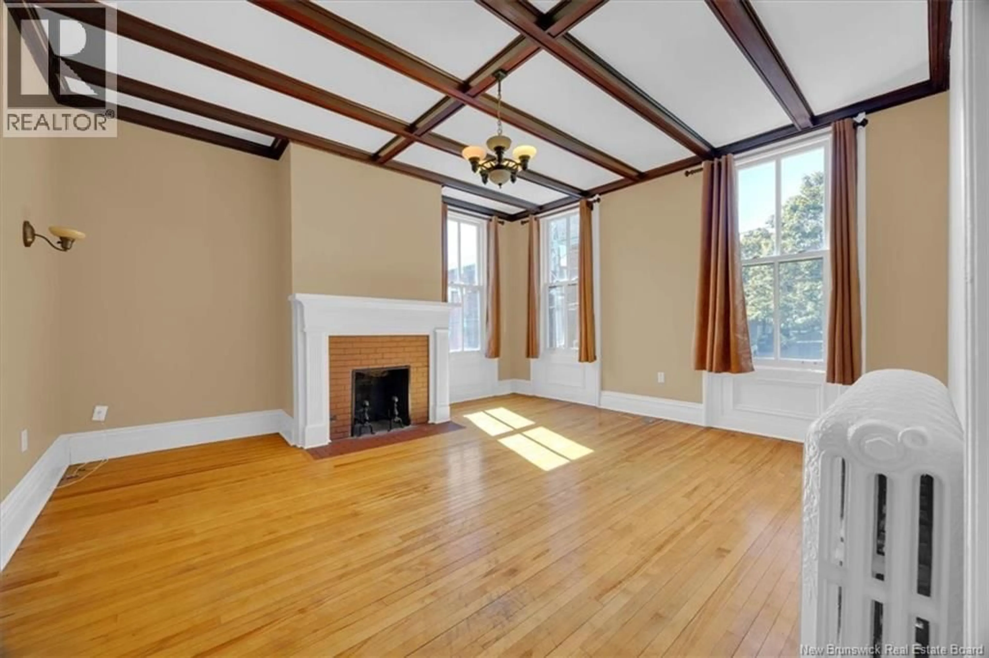 Living room with furniture, wood/laminate floor for 176 SYDNEY STREET, Saint John New Brunswick E2L2M4