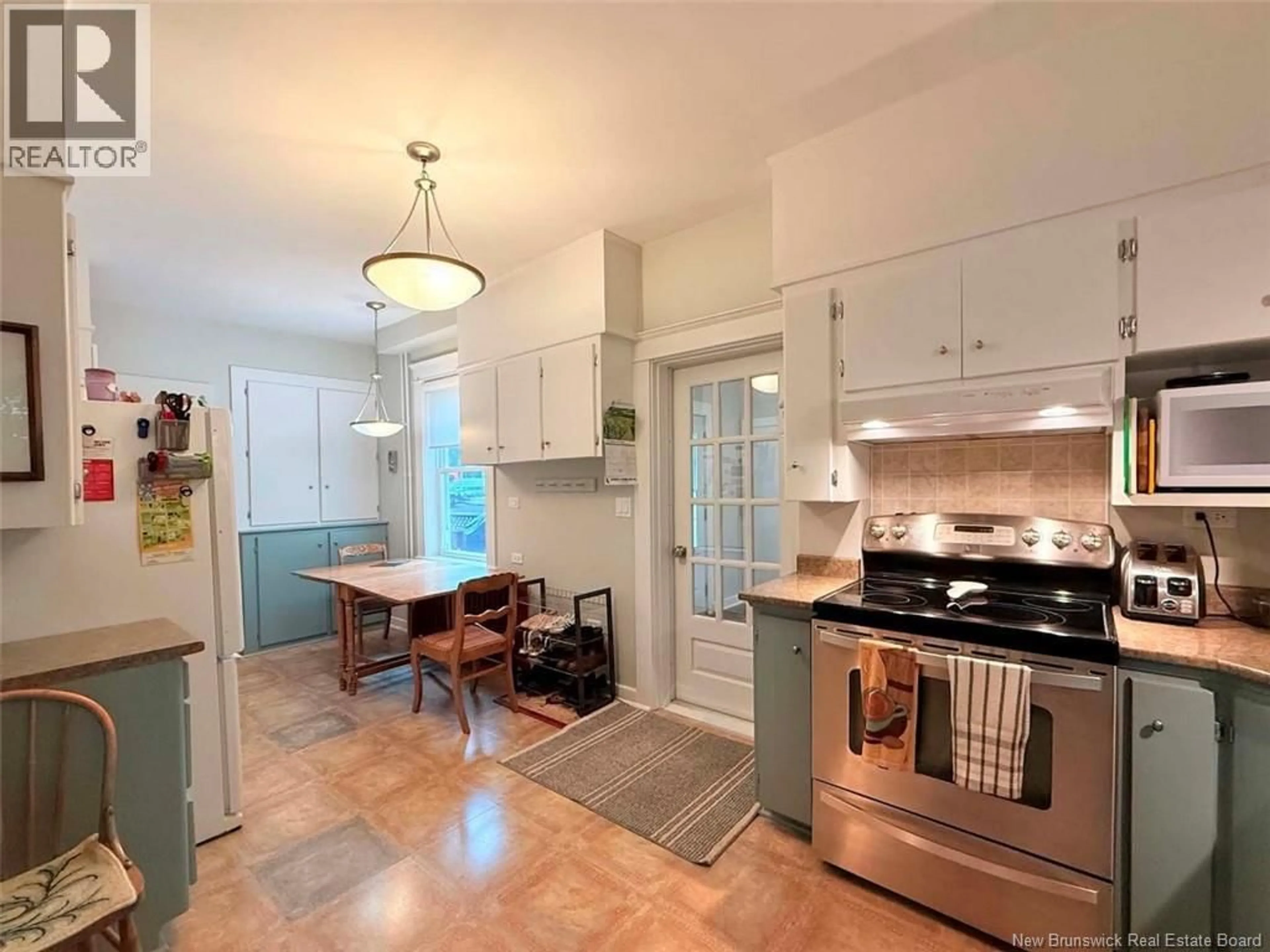 Open concept kitchen, ceramic/tile floor for 12 MATHESON AVENUE, Edmundston New Brunswick E3V2A1