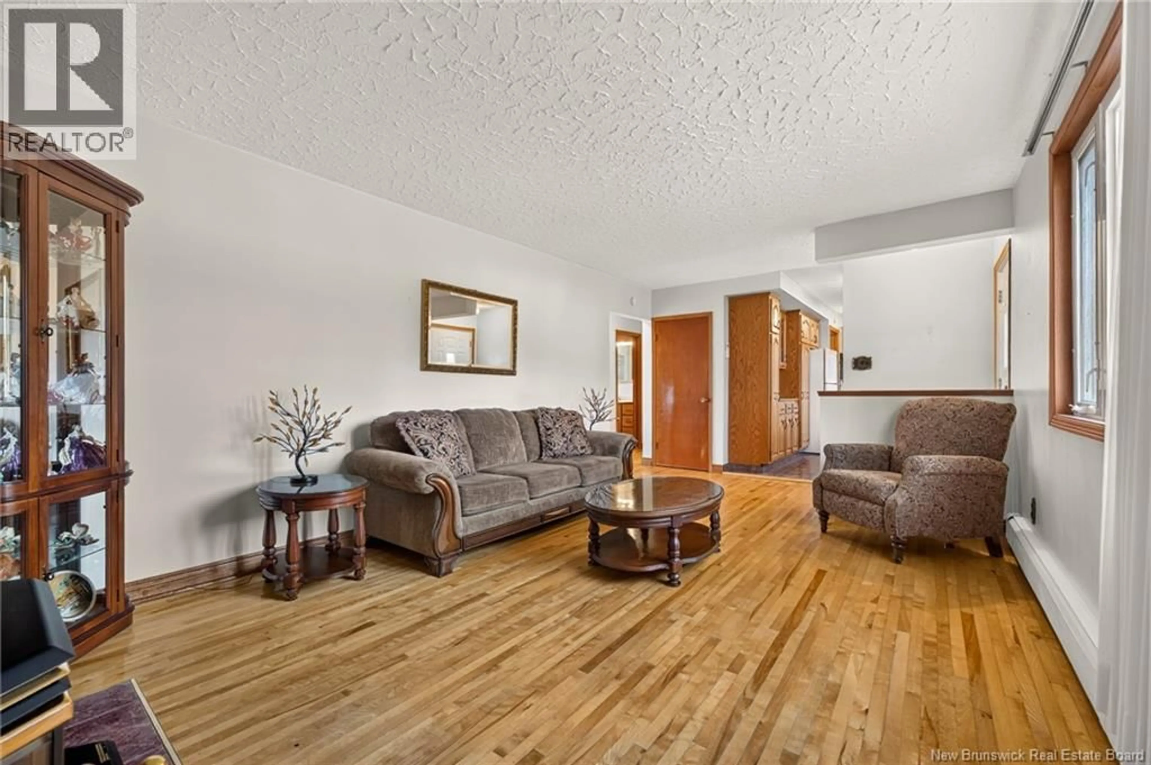Living room with furniture, wood/laminate floor for 153 SECOND AVENUE, Moncton New Brunswick E1C7Y3