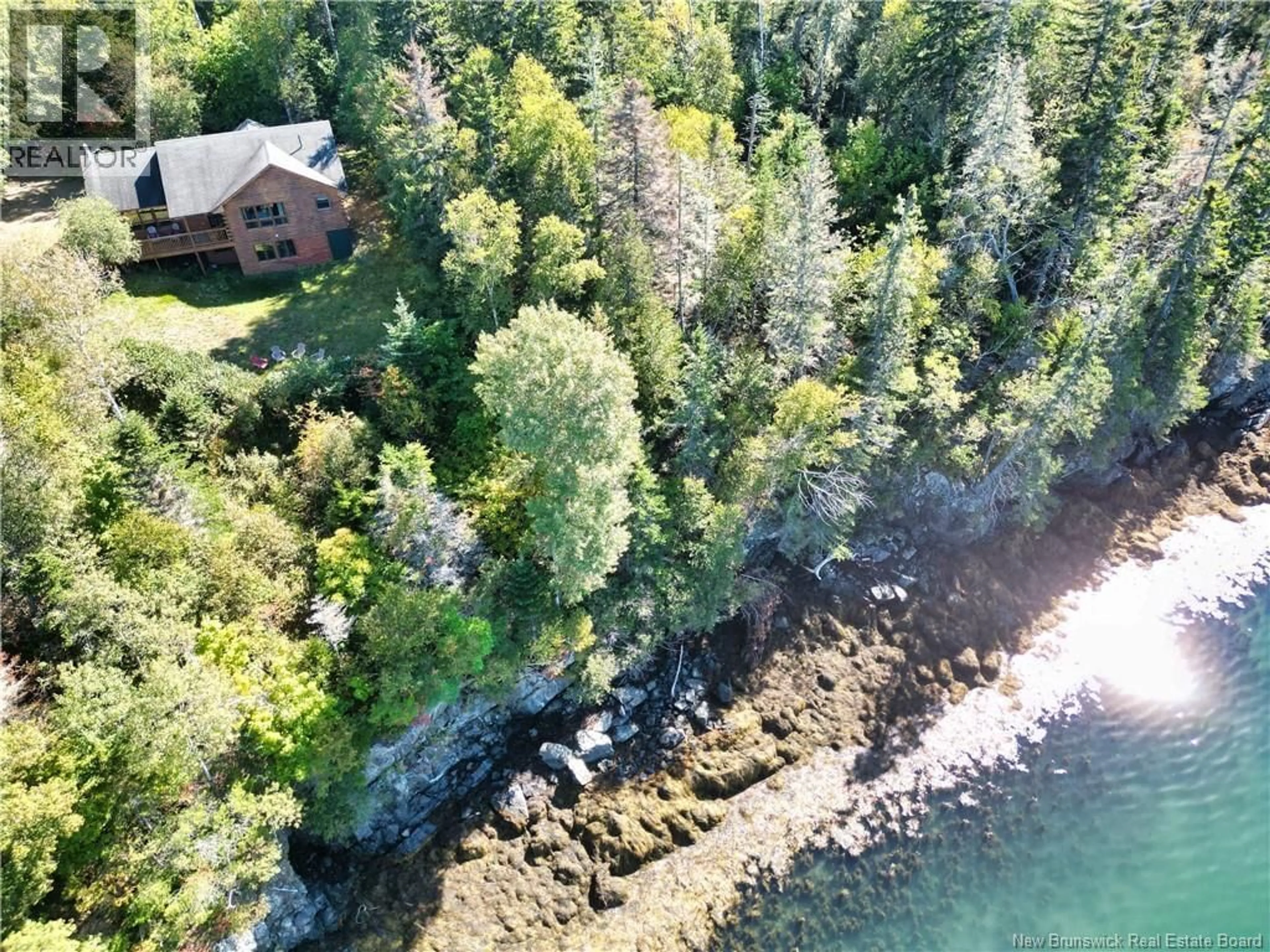 A pic from outside/outdoor area/front of a property/back of a property/a pic from drone, water/lake/river/ocean view for 389 BUNKER HILL ROAD, Wilsons Beach New Brunswick E5E1M4