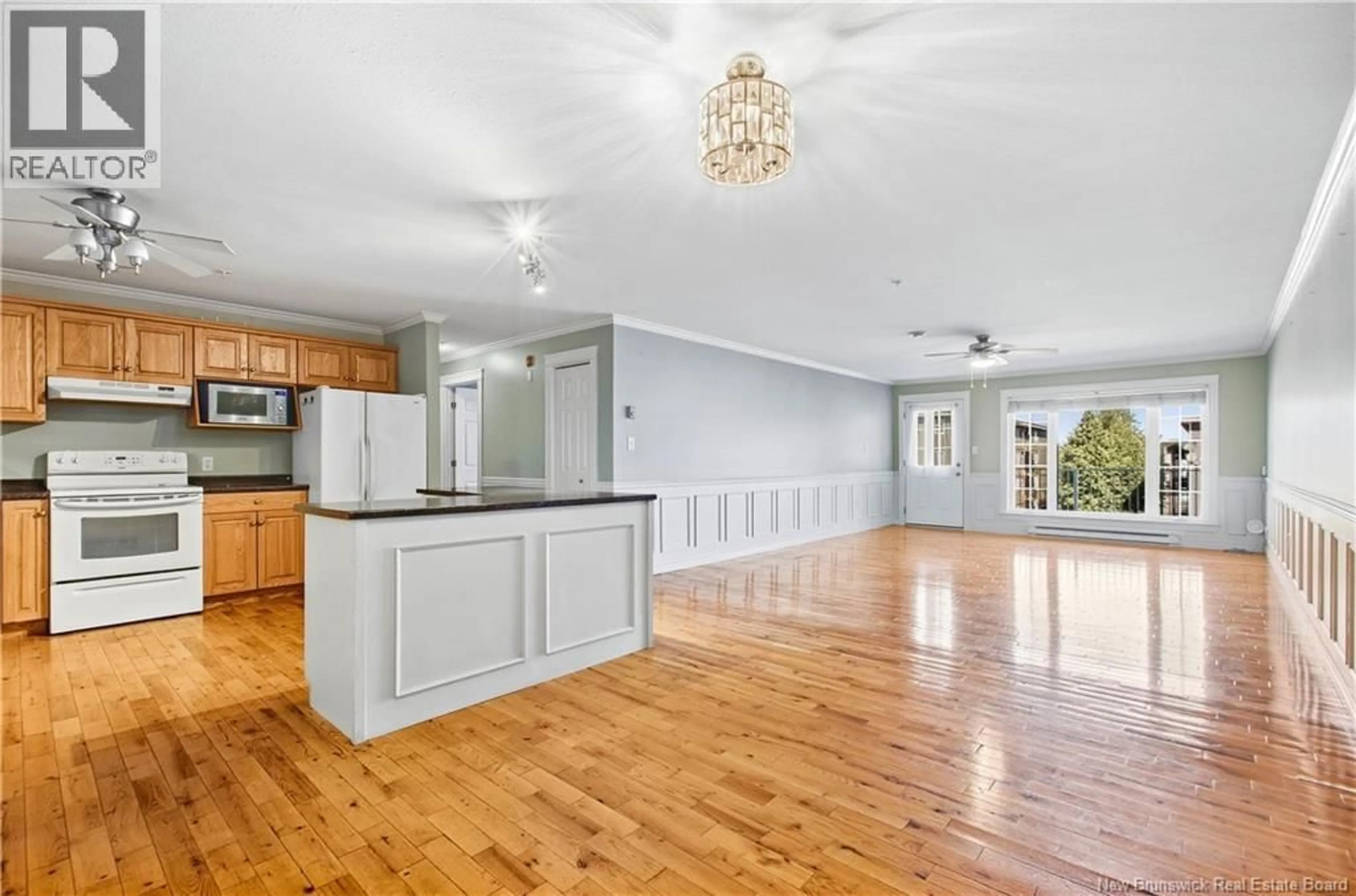 Open concept kitchen, wood/laminate floor for 9 - 35 LIAN STREET, Fredericton New Brunswick E3C0A8