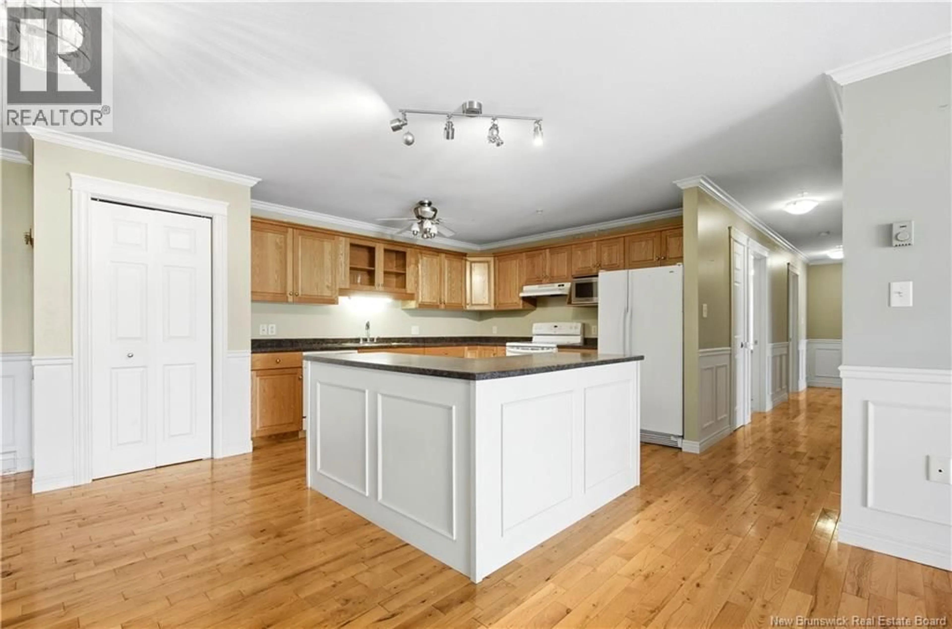 Open concept kitchen, wood/laminate floor for 9 - 35 LIAN STREET, Fredericton New Brunswick E3C0A8
