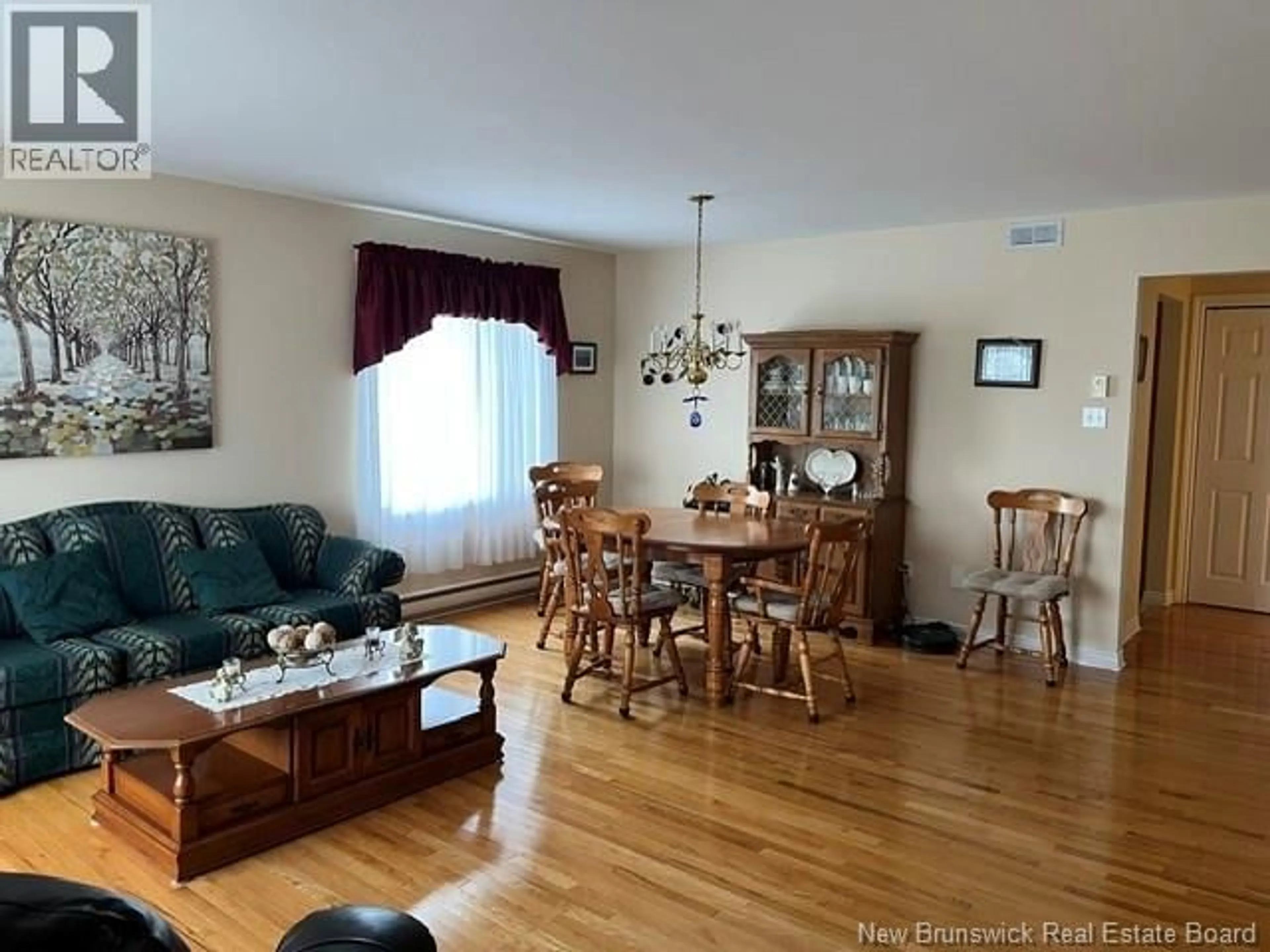 Living room with furniture, wood/laminate floor for 12 CAITLIN COURT, Saint John New Brunswick E2M7V6