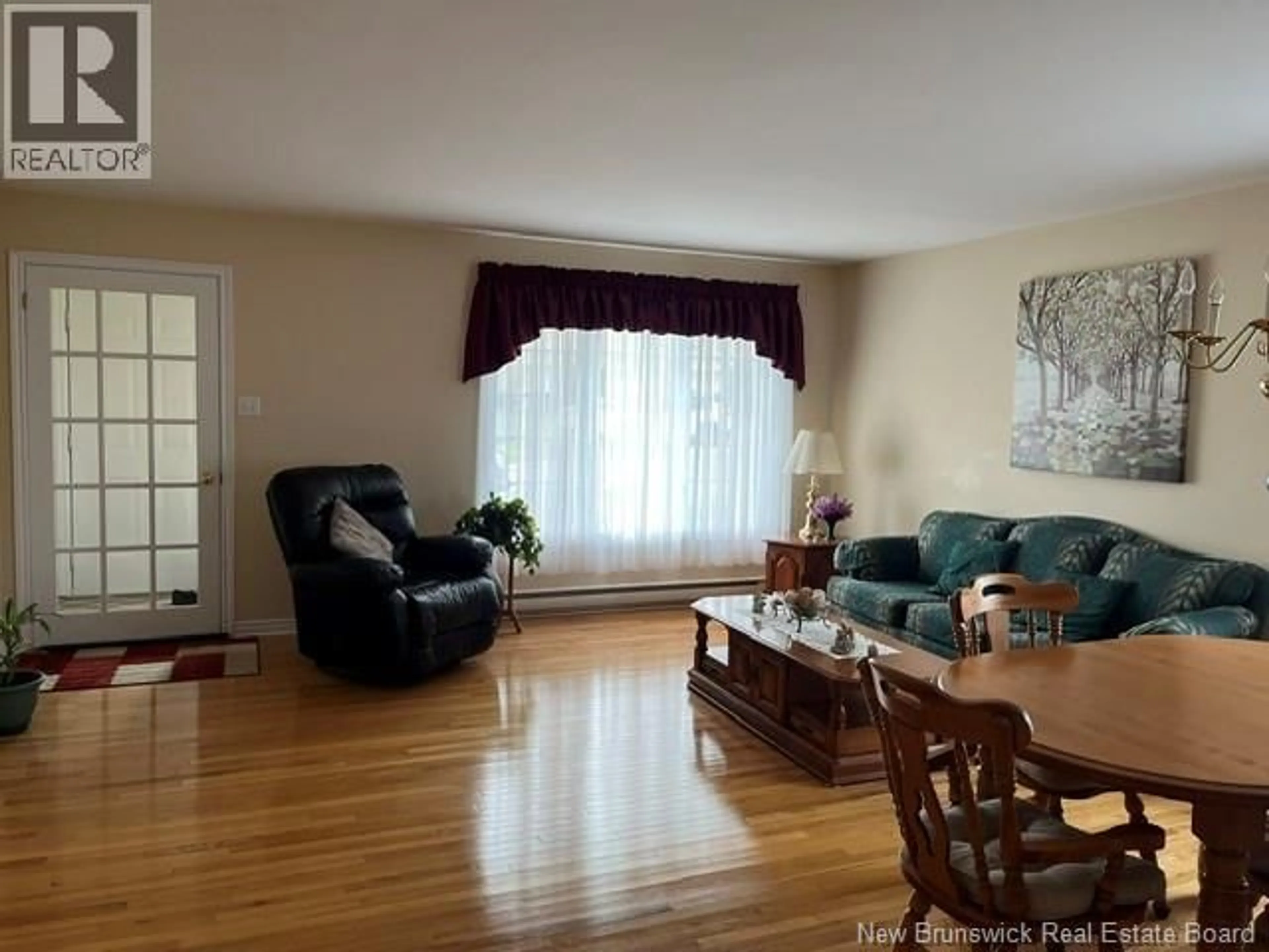 Living room with furniture, wood/laminate floor for 12 CAITLIN COURT, Saint John New Brunswick E2M7V6