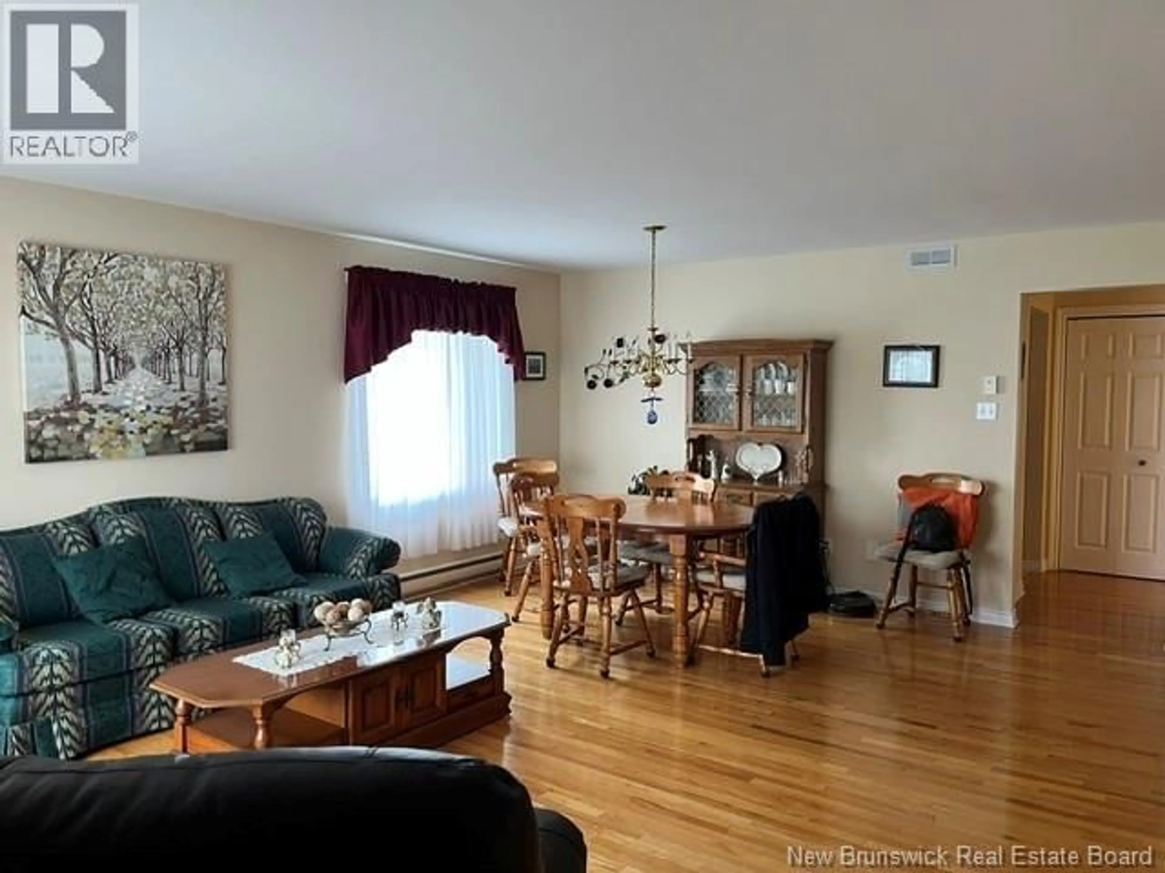 Living room with furniture, wood/laminate floor for 12 CAITLIN COURT, Saint John New Brunswick E2M7V6