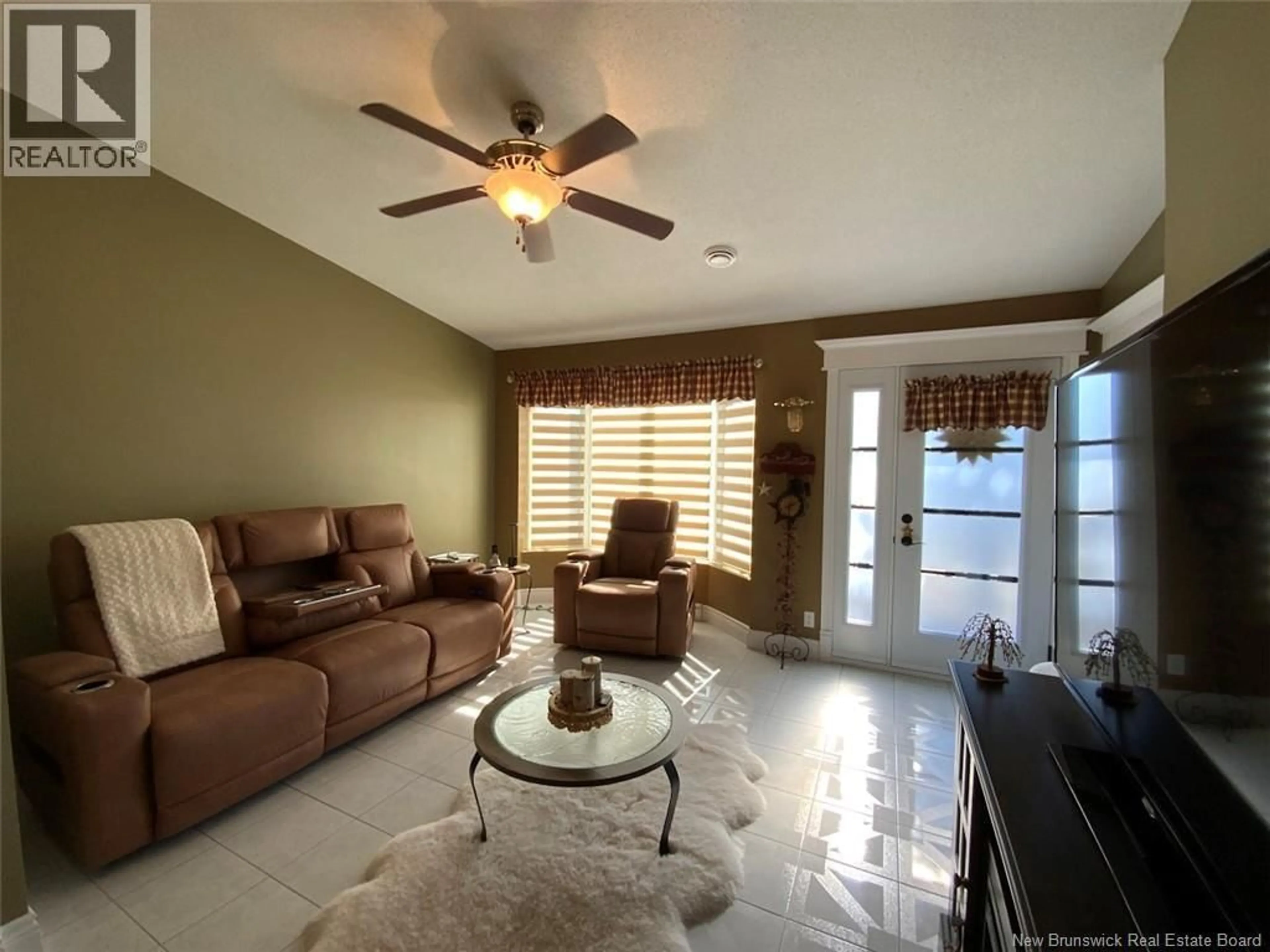 Living room with furniture, ceramic/tile floor for 56 DES GOUVERNEURS STREET, Edmundston New Brunswick E3V4H5