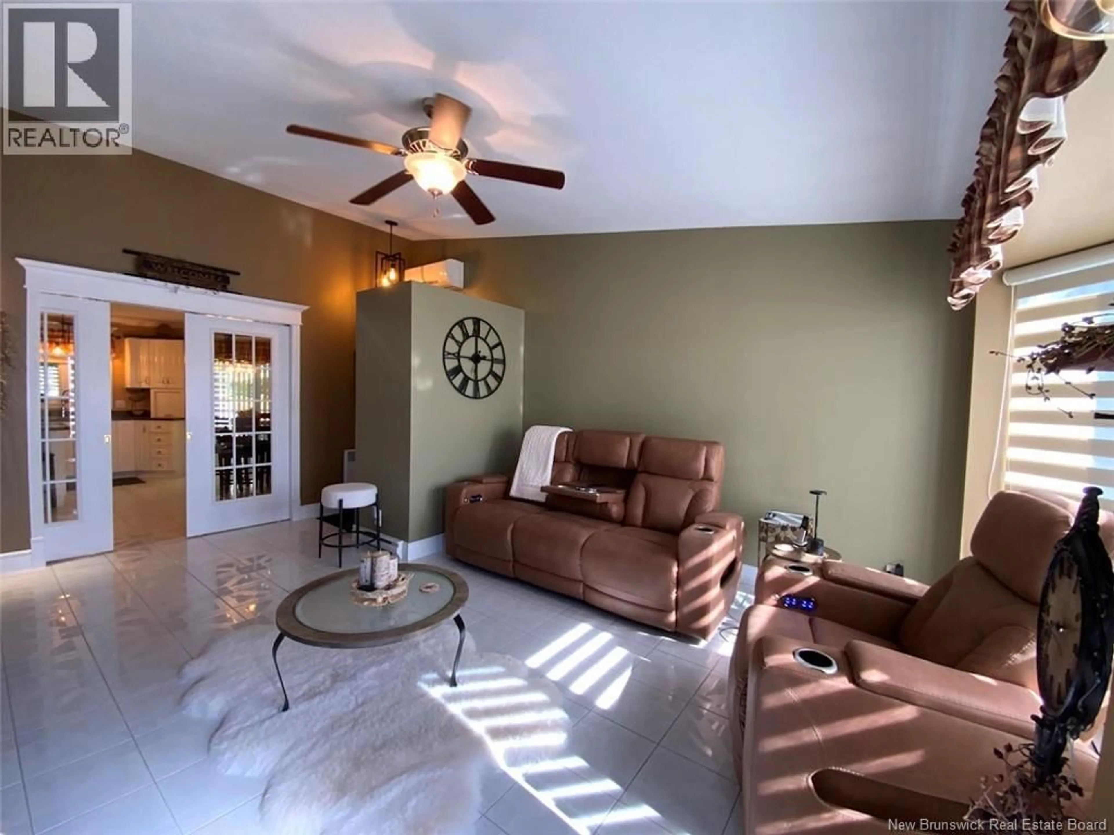 Living room with furniture, ceramic/tile floor for 56 DES GOUVERNEURS STREET, Edmundston New Brunswick E3V4H5