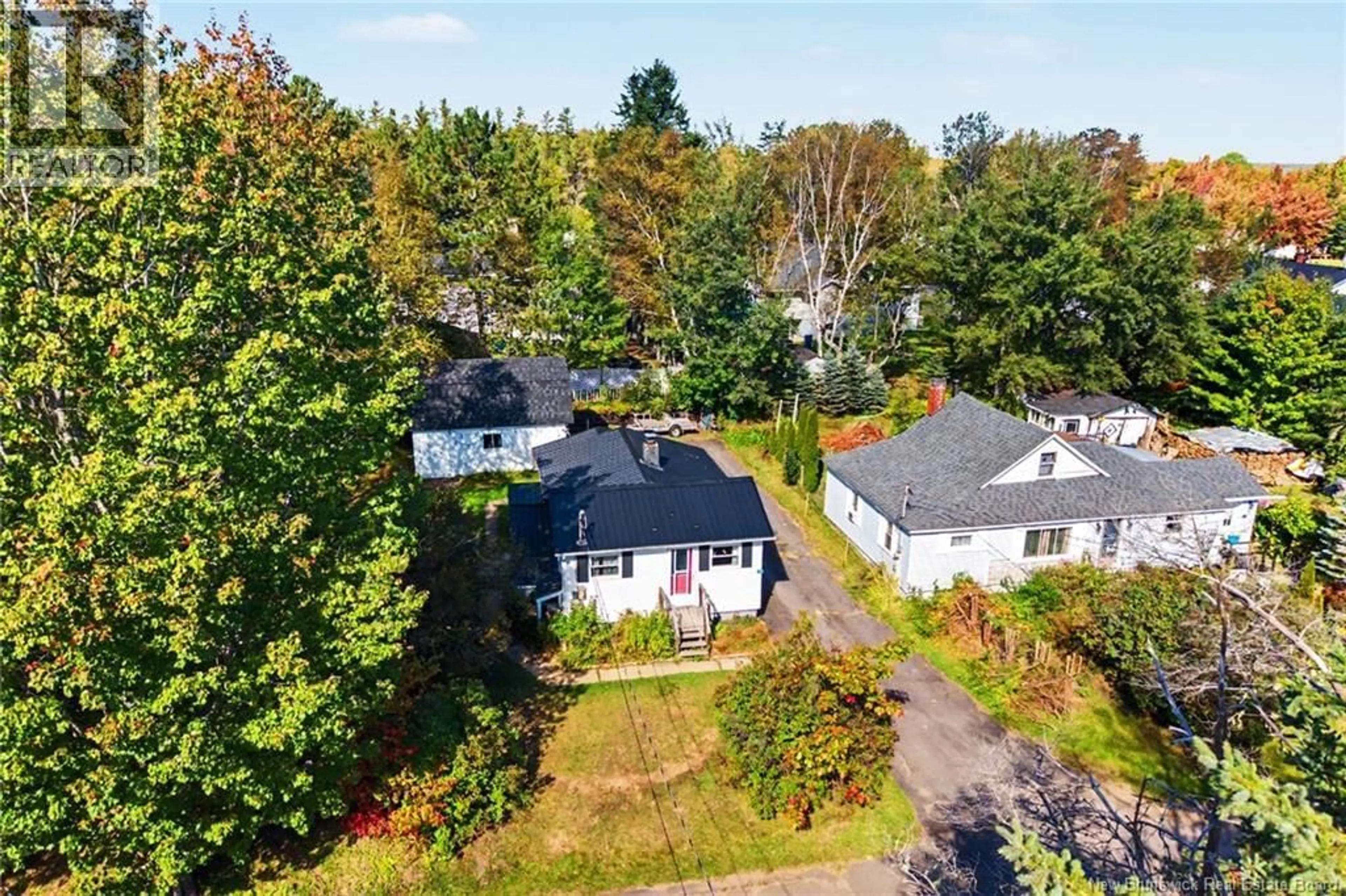 A pic from outside/outdoor area/front of a property/back of a property/a pic from drone, street for 74 CHESTNUT STREET, Minto New Brunswick E4B3L5