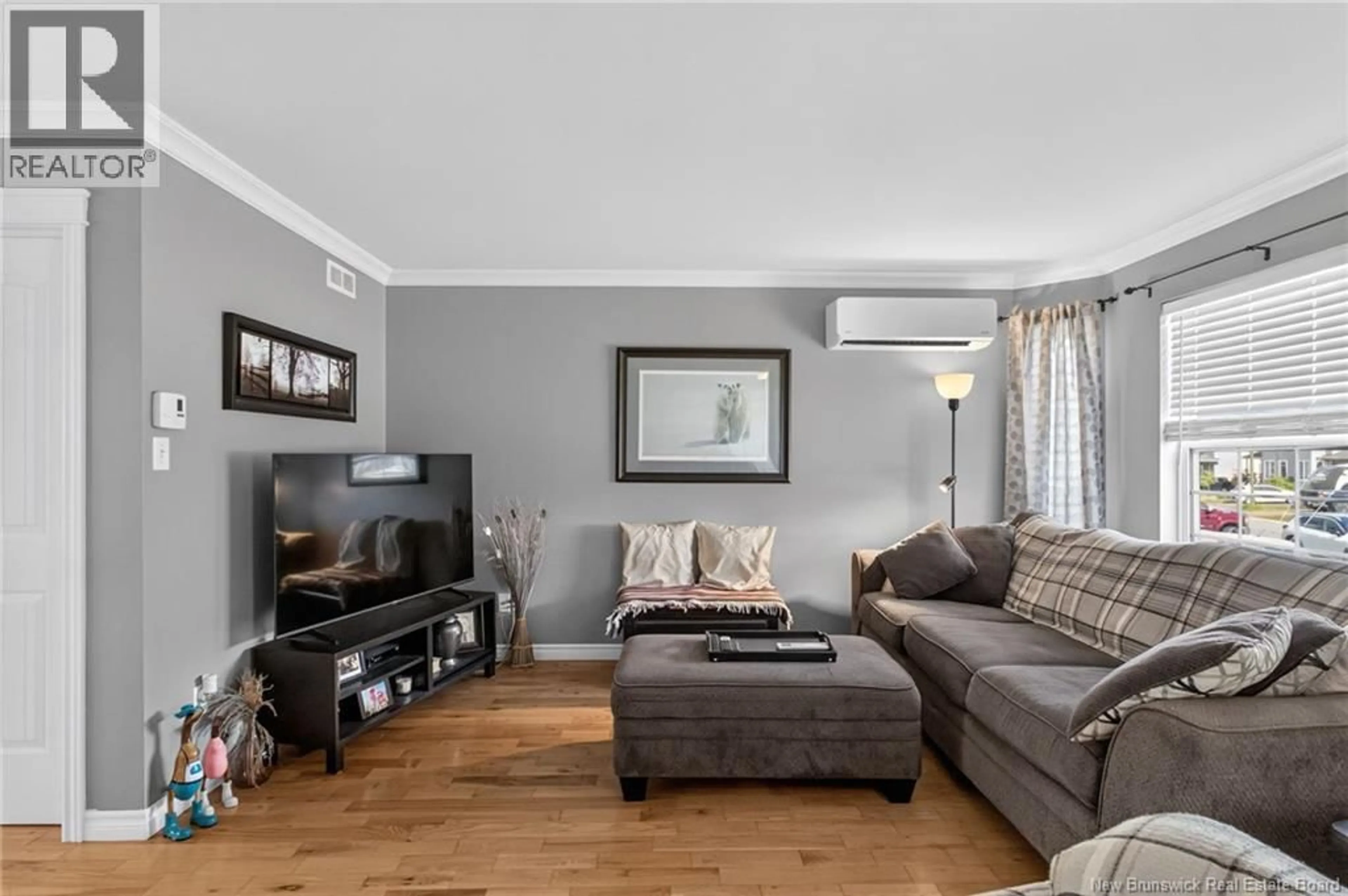 Living room with furniture, wood/laminate floor for 75 CHRISTOPHER CRESCENT, Moncton New Brunswick E1G0A4