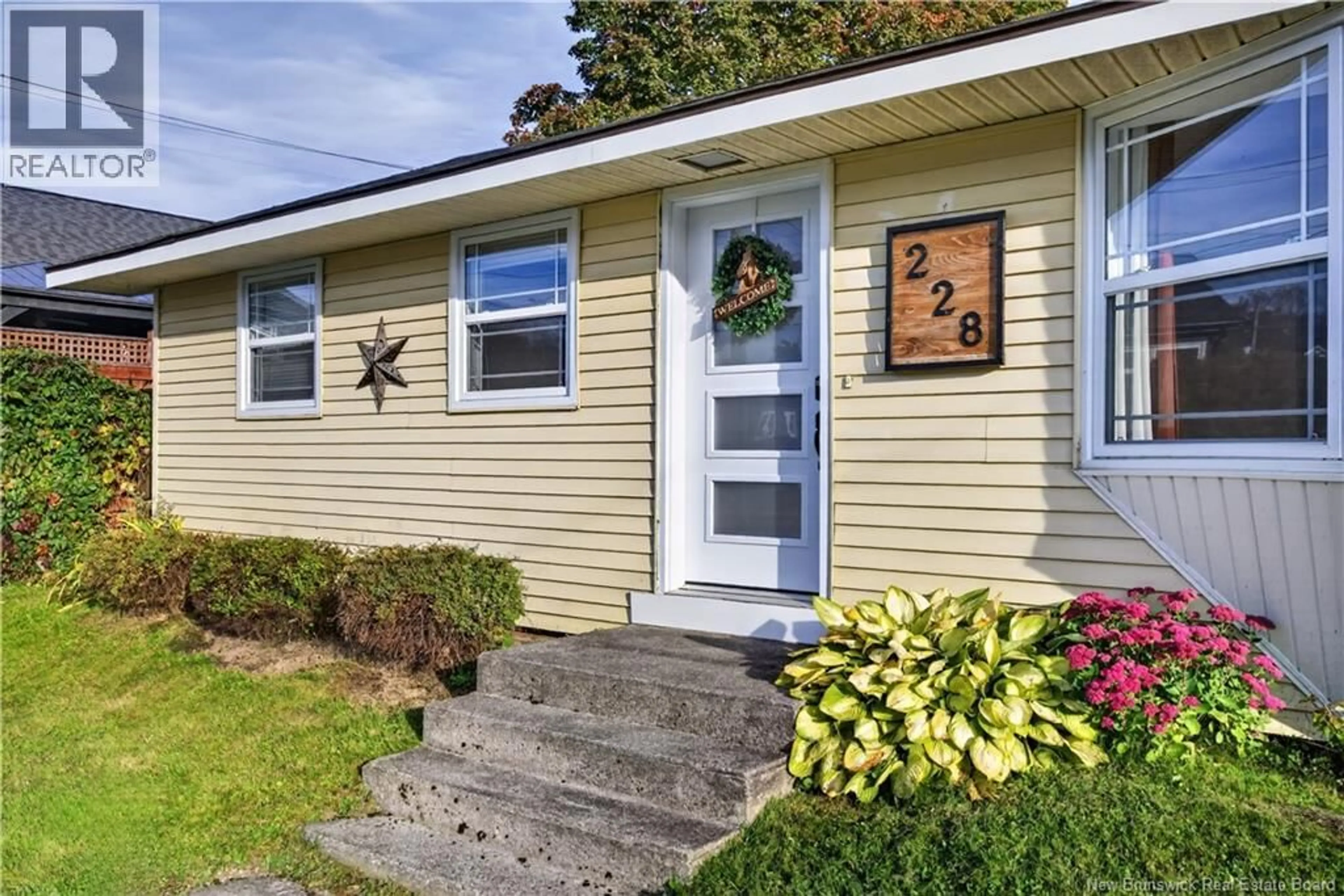 Home with vinyl exterior material, street for 228 WELLINGTON STREET, Miramichi New Brunswick E1N1M9
