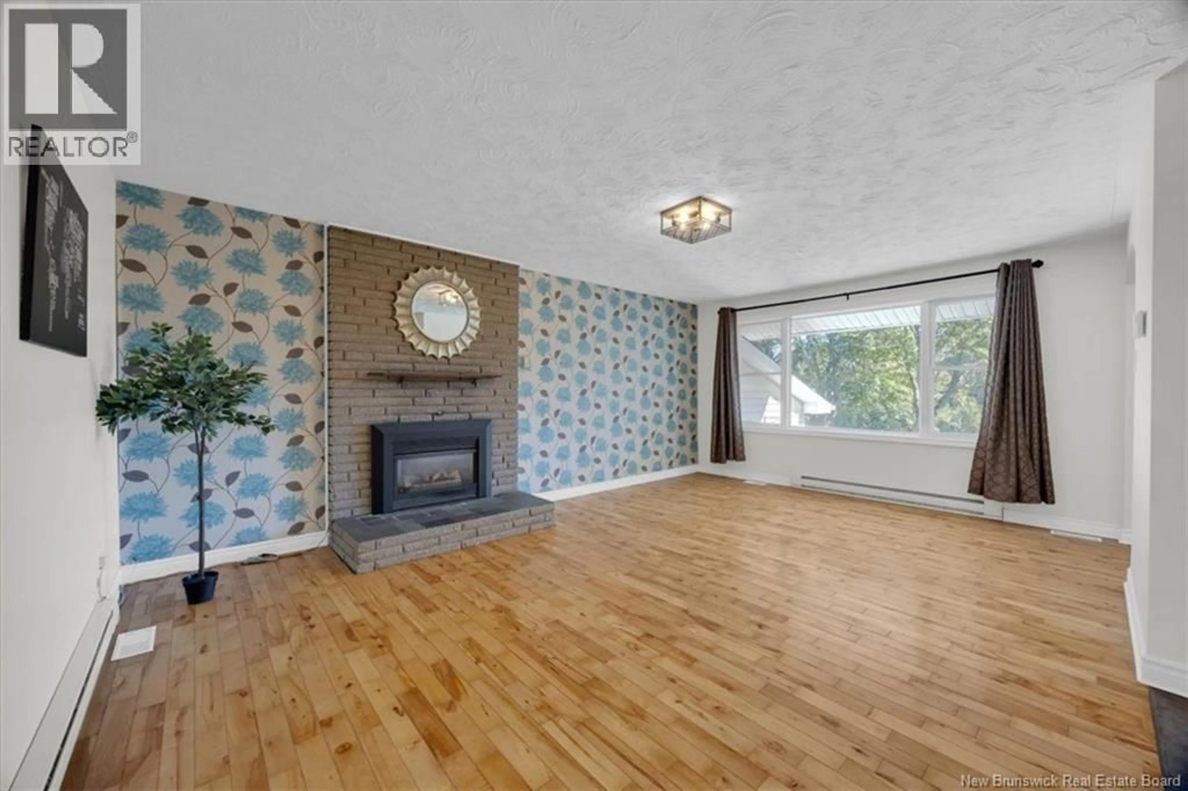 Living room with furniture, wood/laminate floor for 89 ASHFIELD DRIVE, Quispamsis New Brunswick E2G1P8