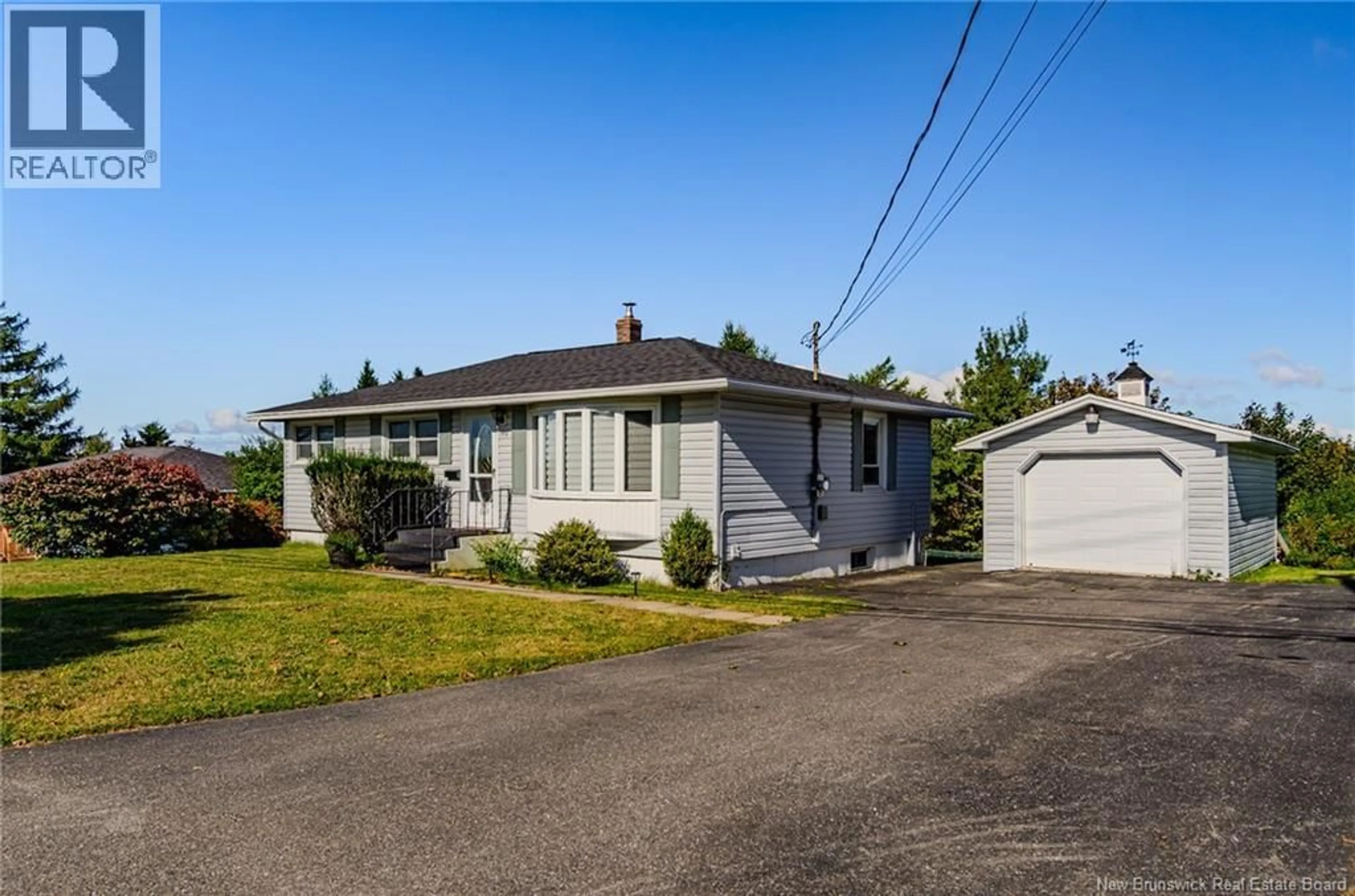 Home with vinyl exterior material, street for 590 WESTMORLAND ROAD, Saint John New Brunswick E2J2H1