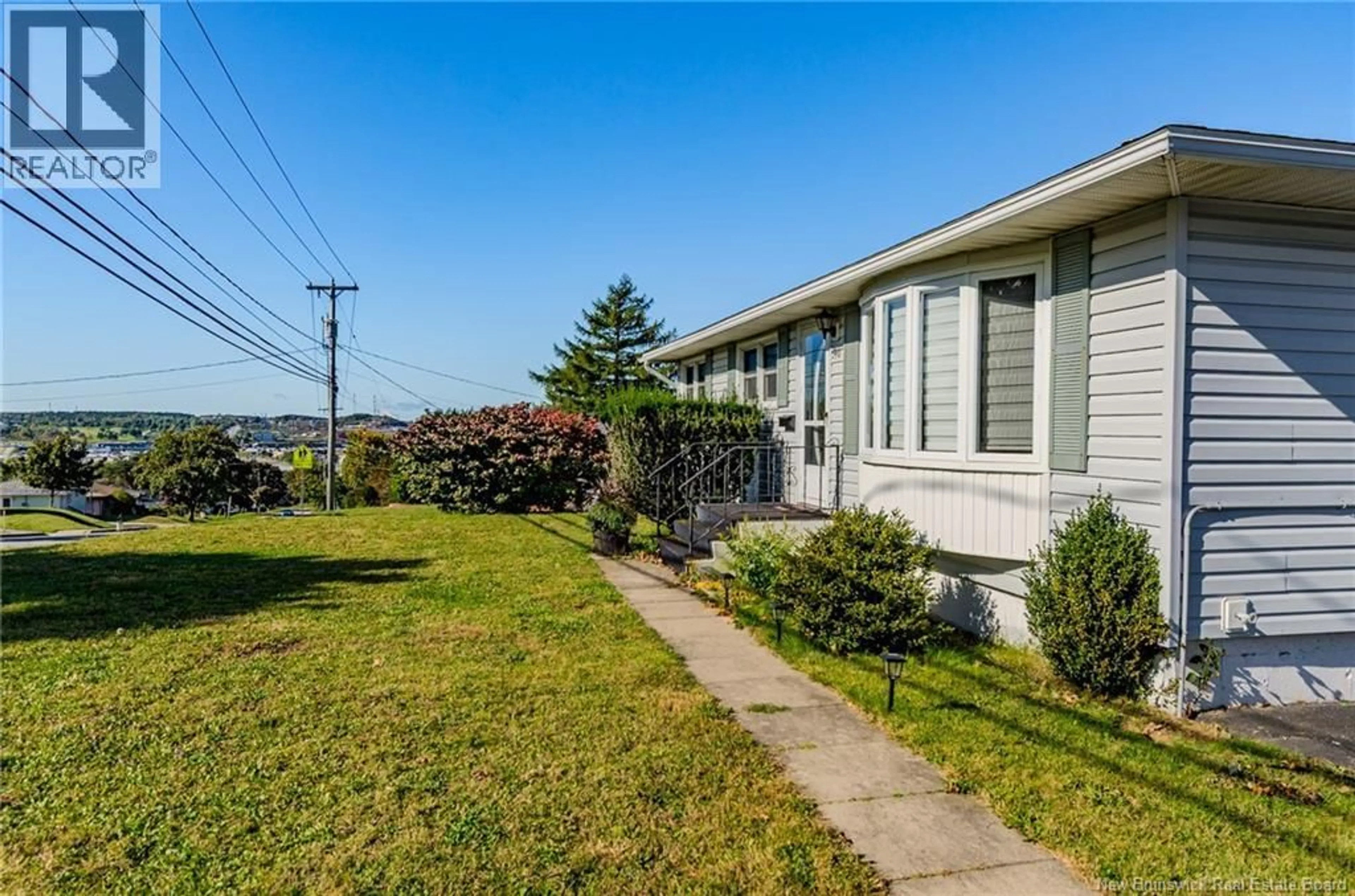 Home with vinyl exterior material, street for 590 WESTMORLAND ROAD, Saint John New Brunswick E2J2H1