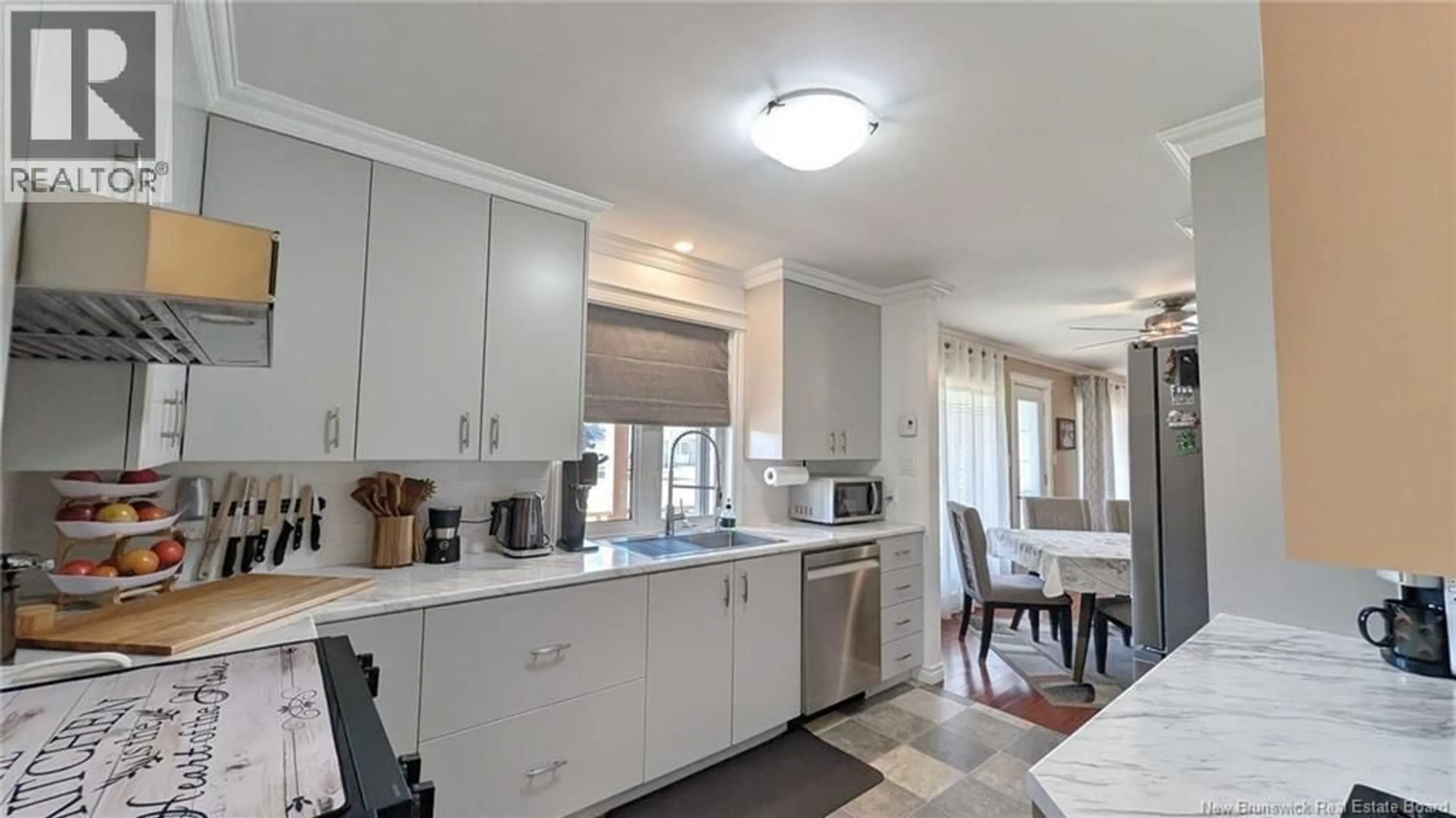 Open concept kitchen, ceramic/tile floor for 63 CHEMIN ST SIMON, Caraquet New Brunswick E1W1B3