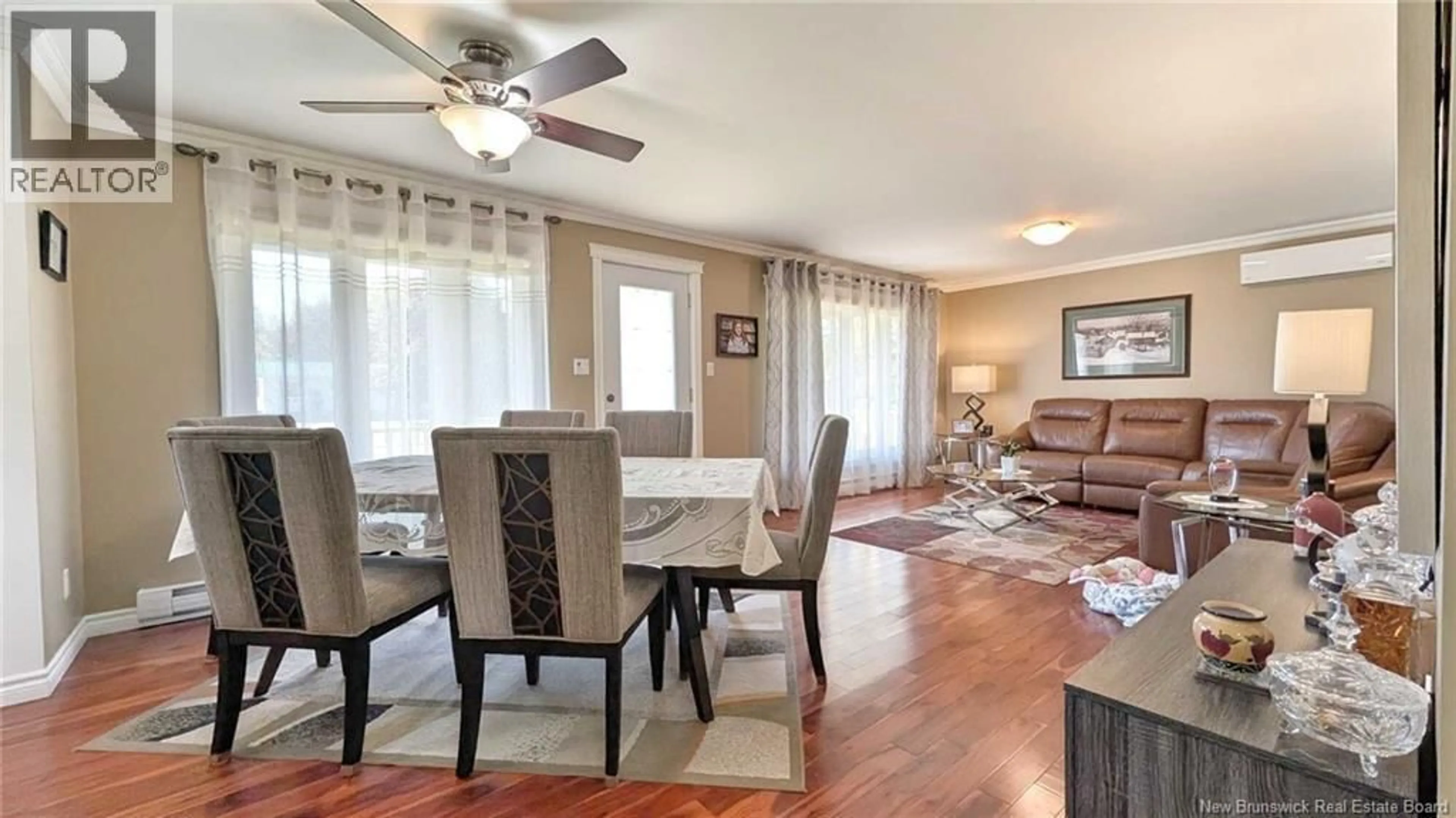 Living room with furniture, wood/laminate floor for 63 CHEMIN ST SIMON, Caraquet New Brunswick E1W1B3