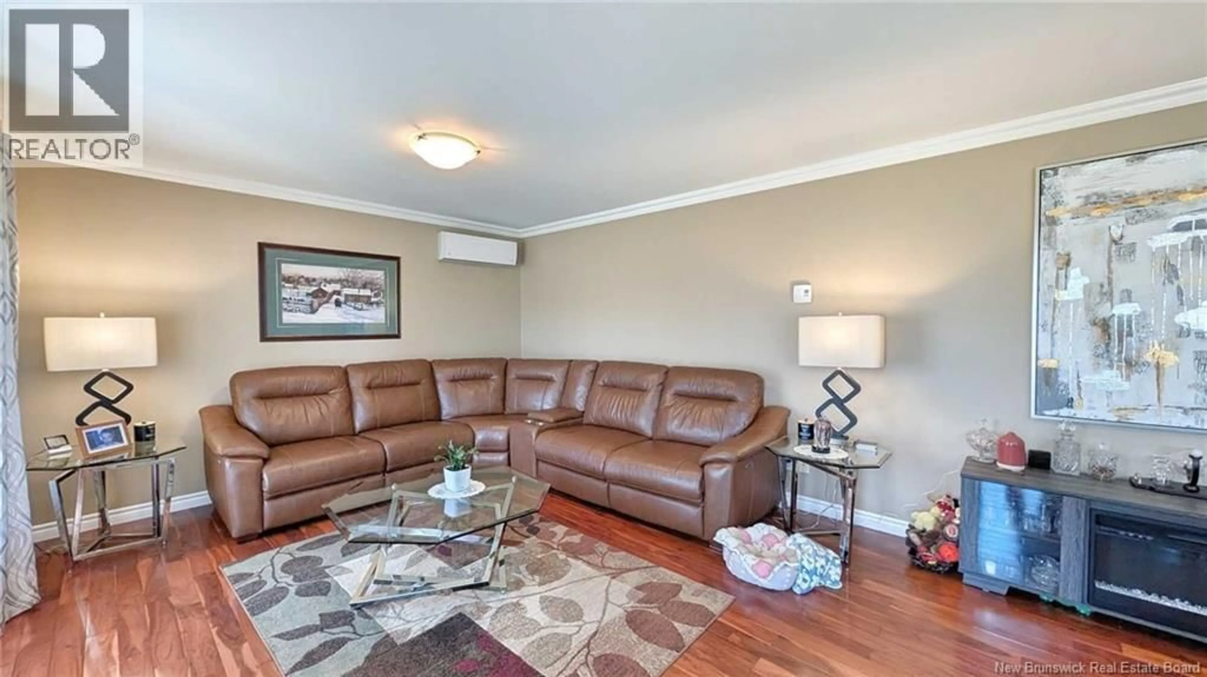 Living room with furniture, wood/laminate floor for 63 CHEMIN ST SIMON, Caraquet New Brunswick E1W1B3