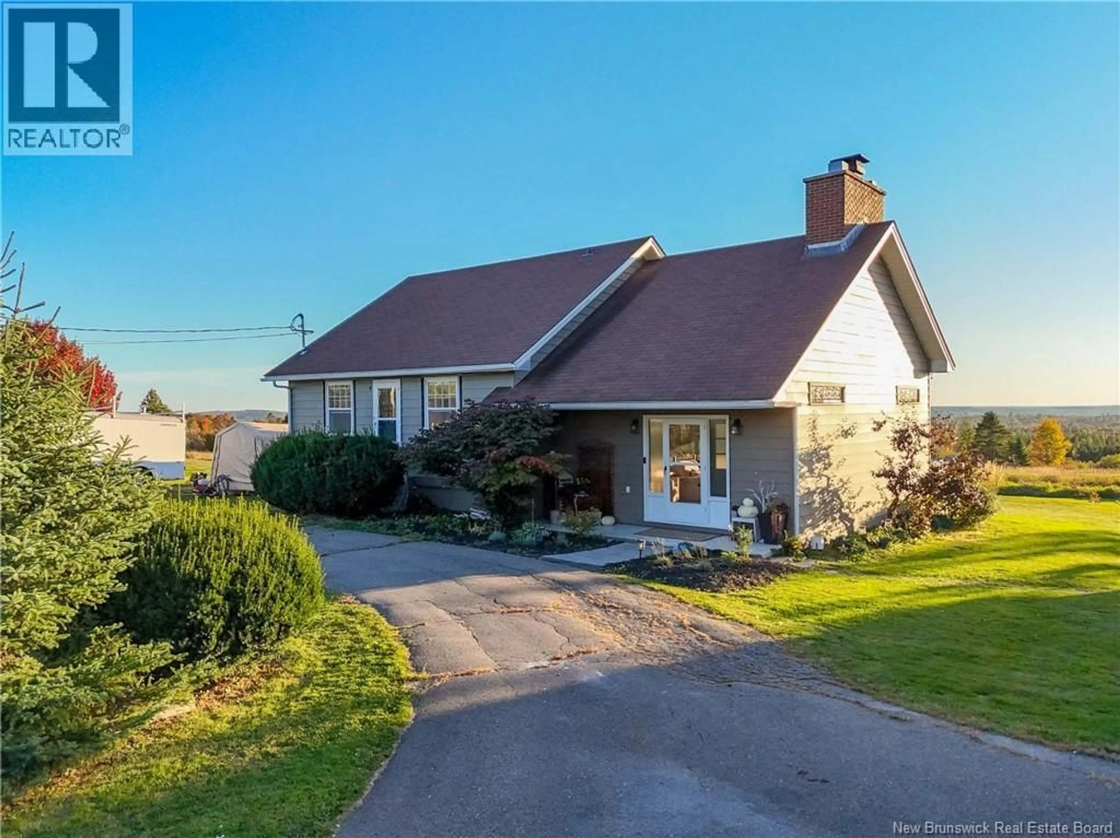A pic from outside/outdoor area/front of a property/back of a property/a pic from drone, street for 18 FROG LAKE ROAD, Harvey New Brunswick E6K2C6