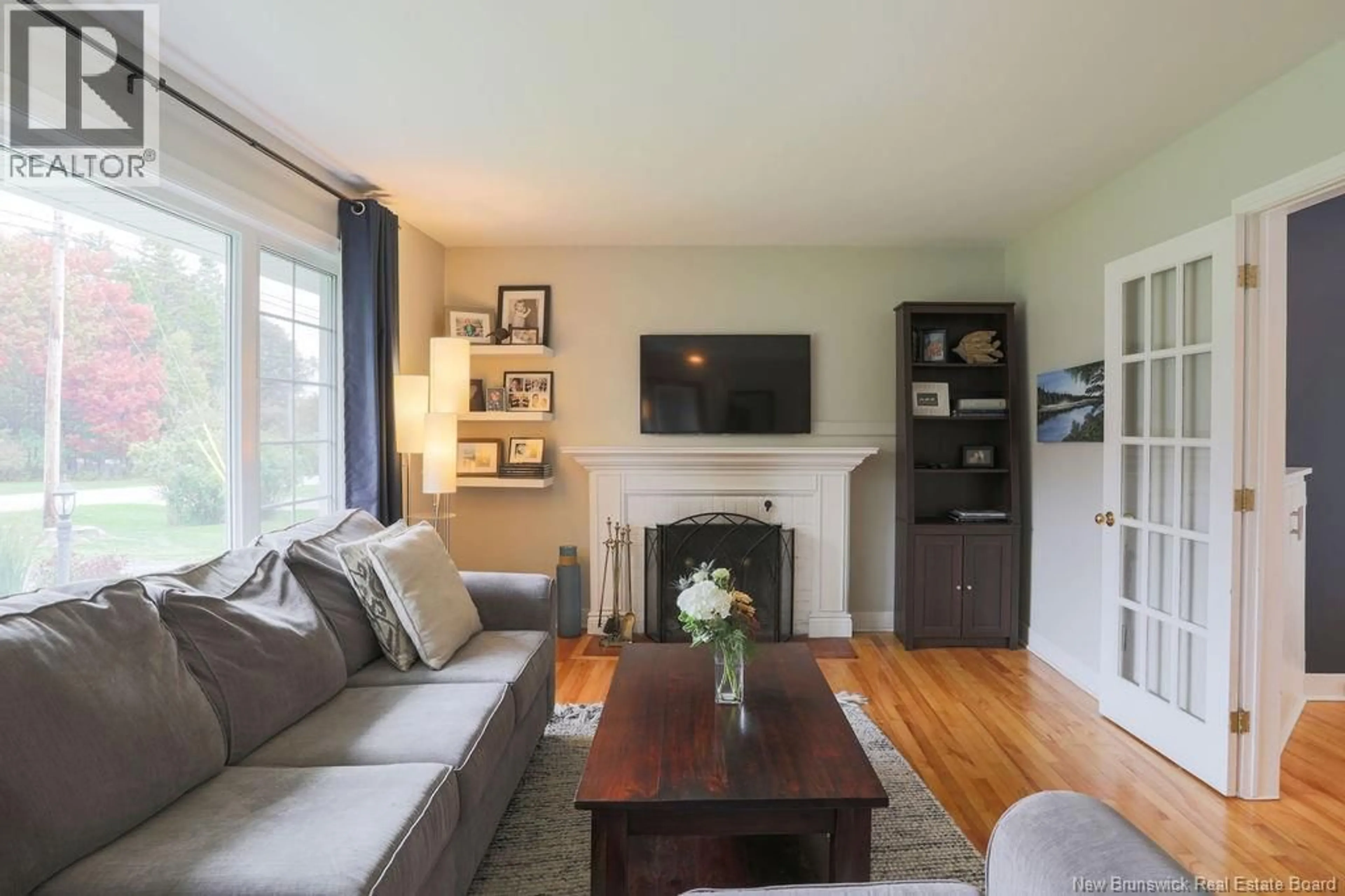 Living room with furniture, wood/laminate floor for 38 FOREST ROAD, Rothesay New Brunswick E2H1B5