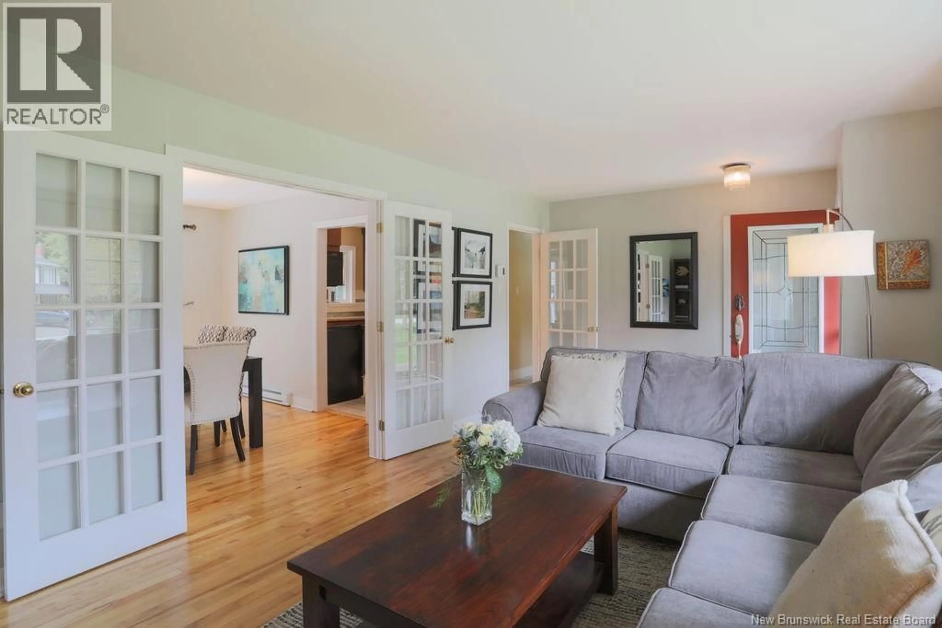 Living room with furniture, wood/laminate floor for 38 FOREST ROAD, Rothesay New Brunswick E2H1B5