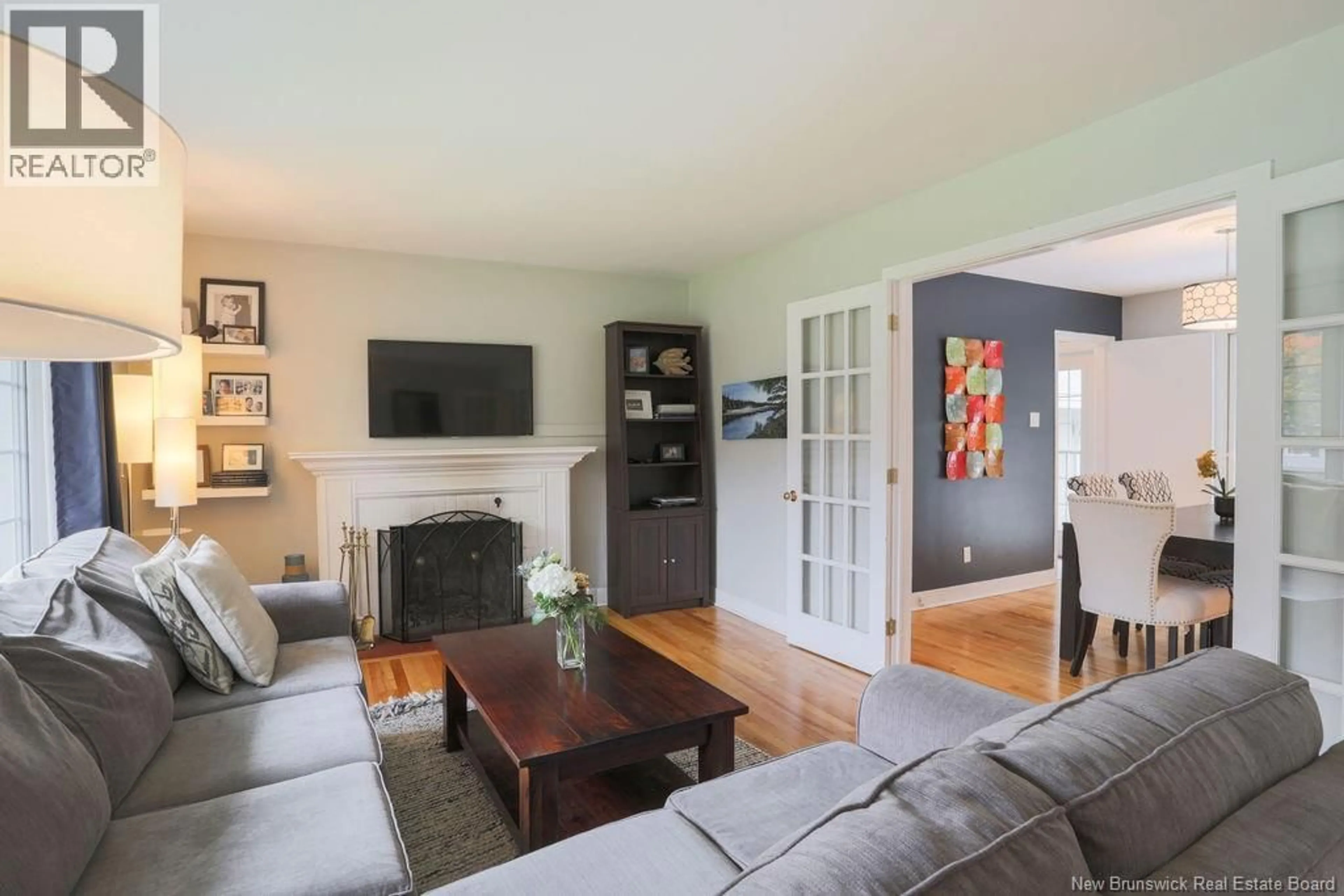 Living room with furniture, wood/laminate floor for 38 FOREST ROAD, Rothesay New Brunswick E2H1B5