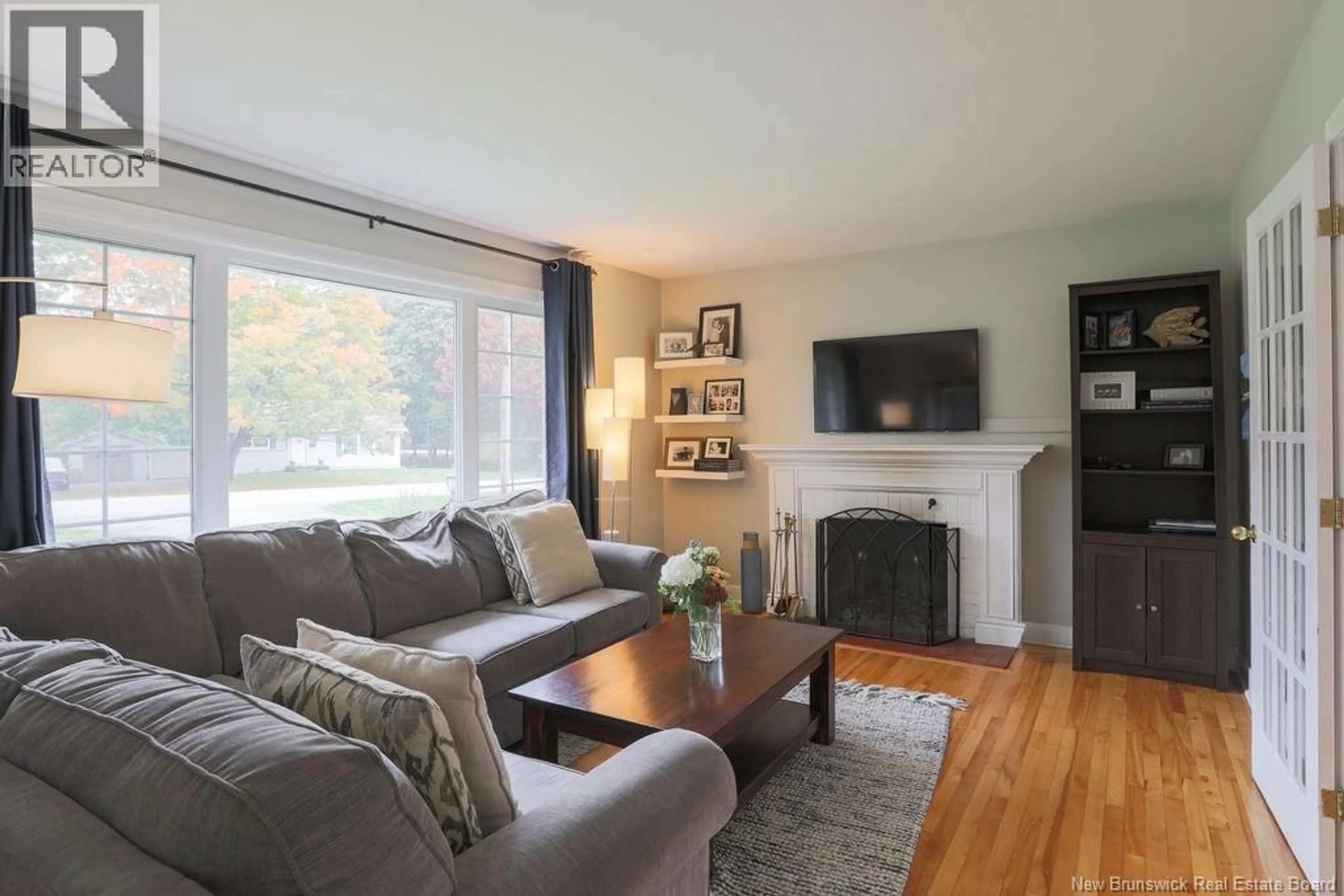 Living room with furniture, wood/laminate floor for 38 FOREST ROAD, Rothesay New Brunswick E2H1B5